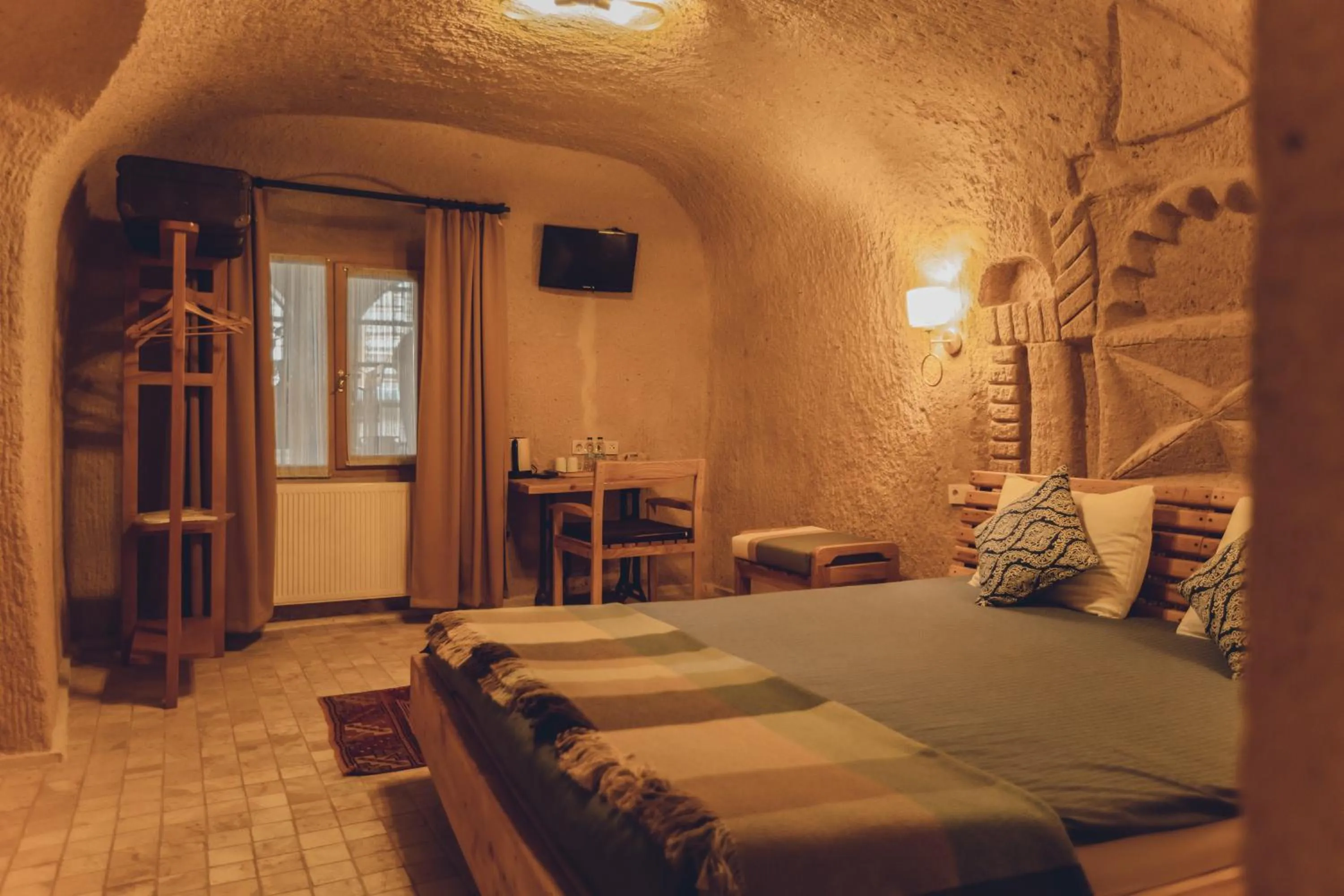 Bed in Pinhan Cave Suites