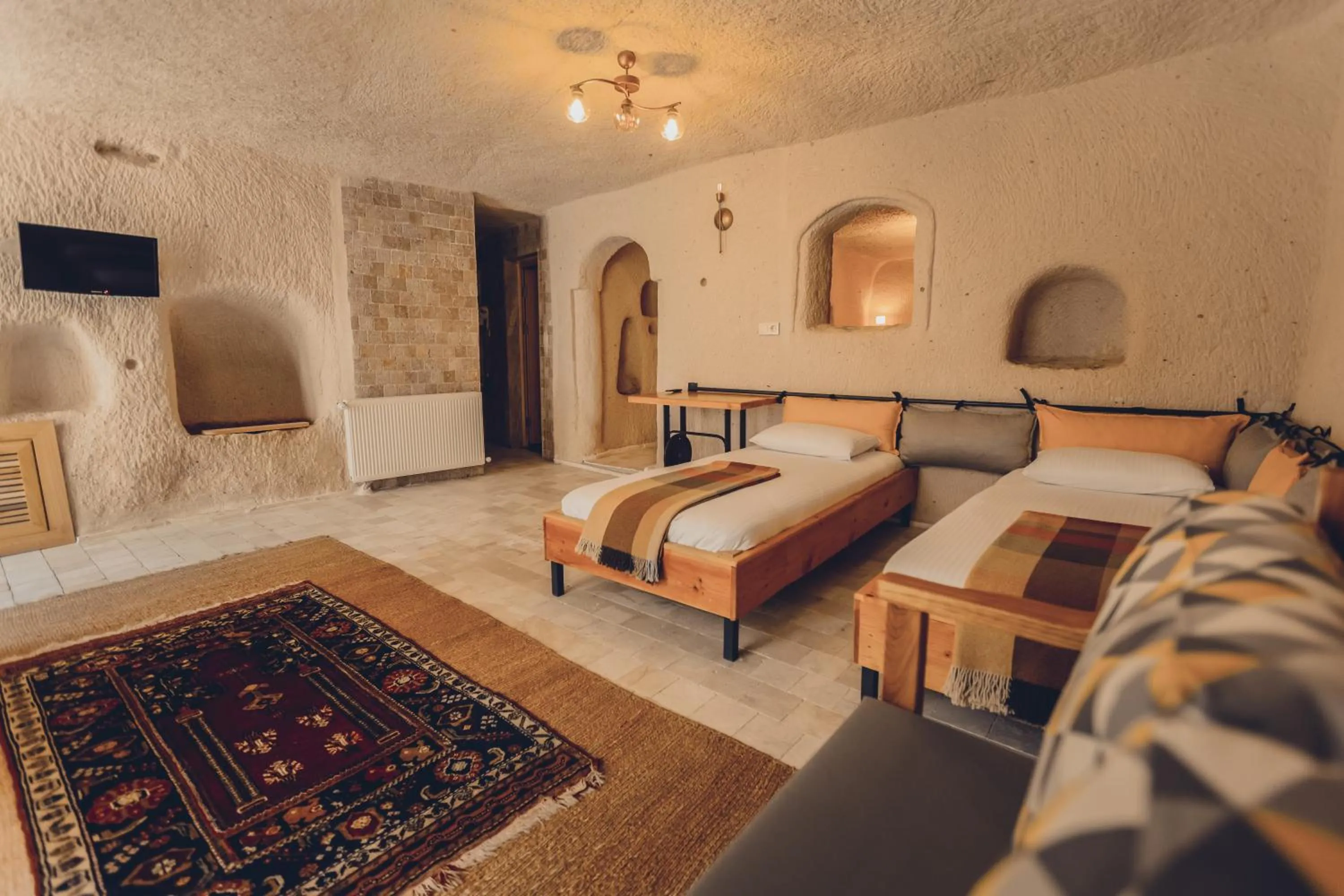 Bed in Pinhan Cave Suites