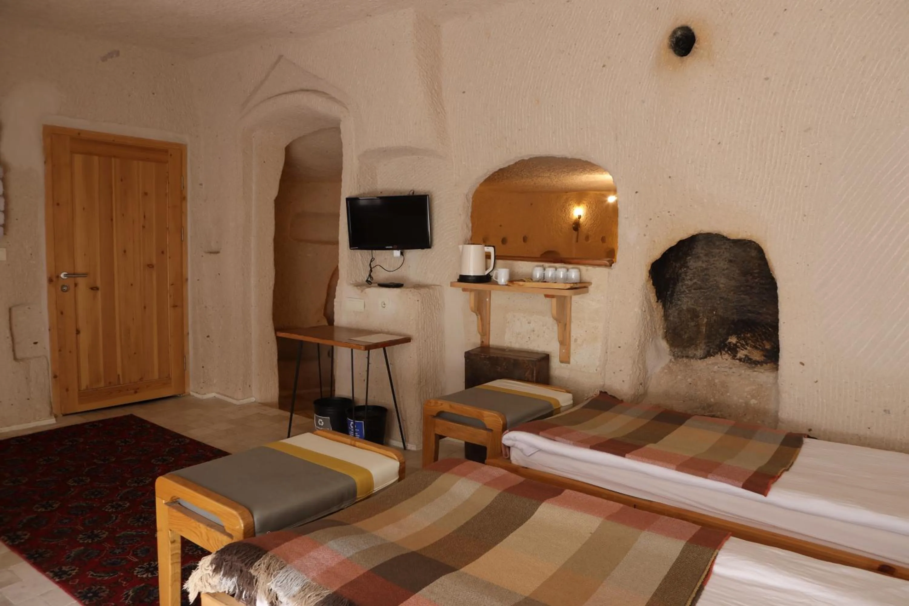 Bed in Pinhan Cave Suites