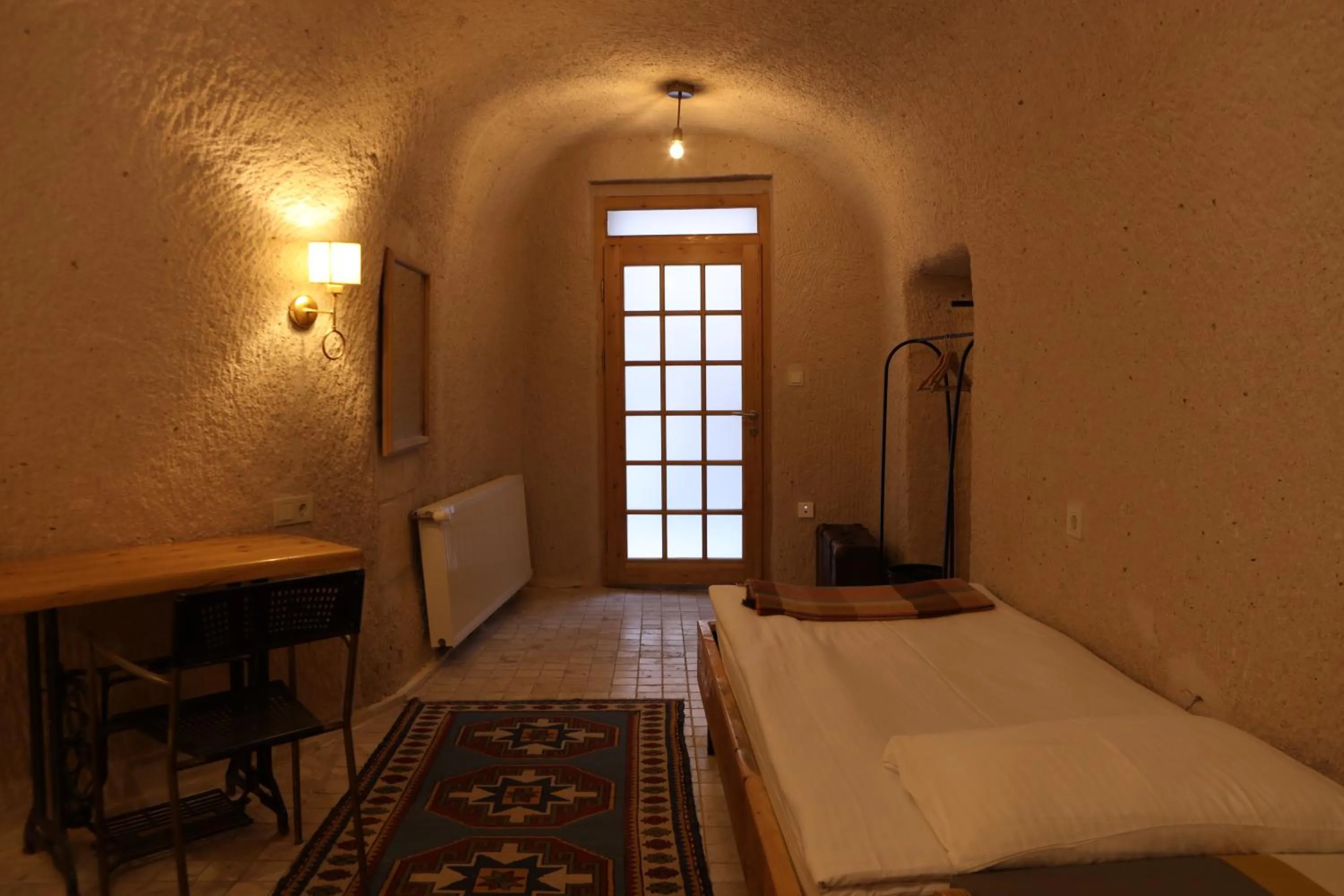 Bed in Pinhan Cave Suites