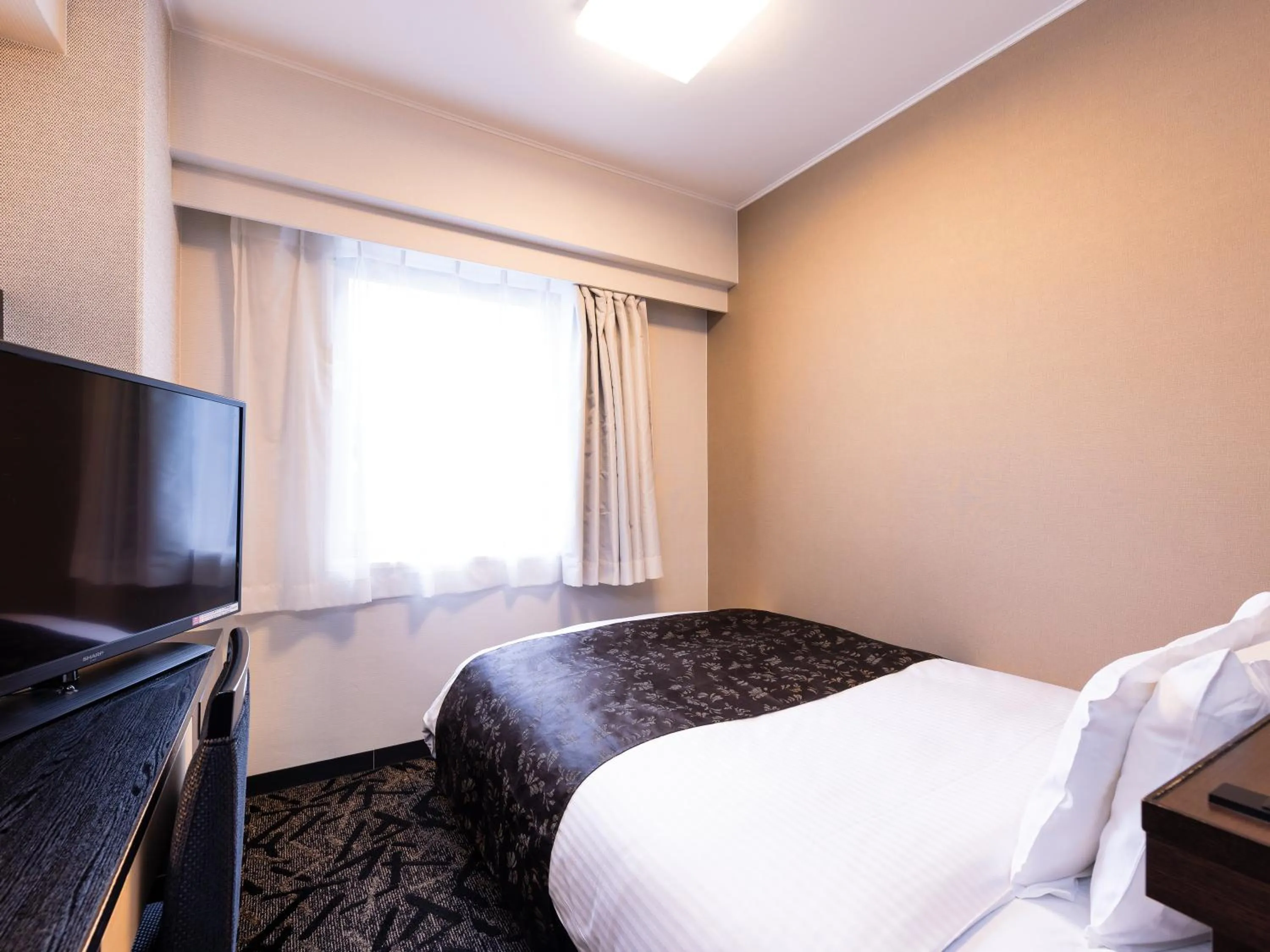 Photo of the whole room, Bed in APA Hotel Kokura Ekimae
