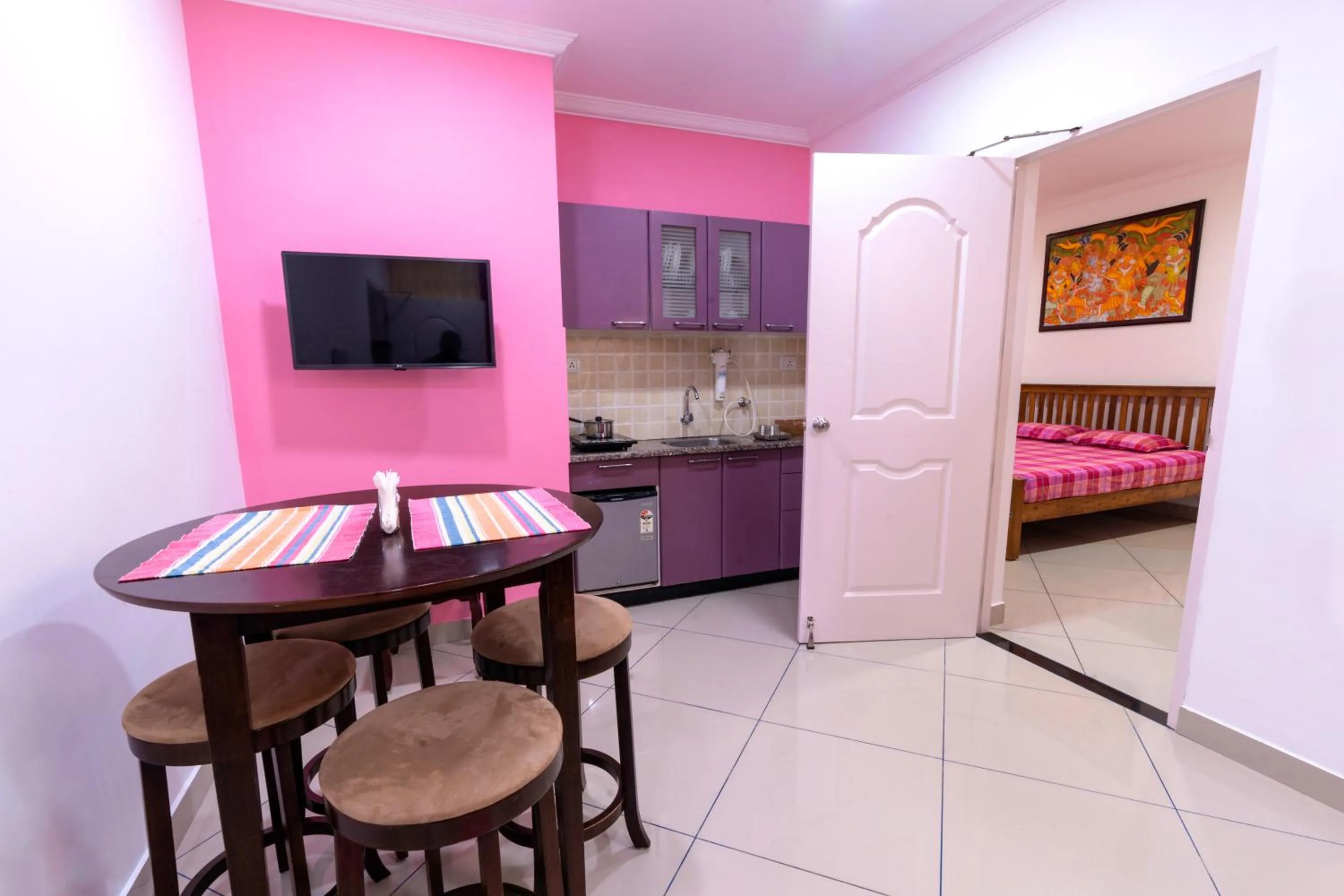 Living room, Bed in Vasudevam Premium Suites