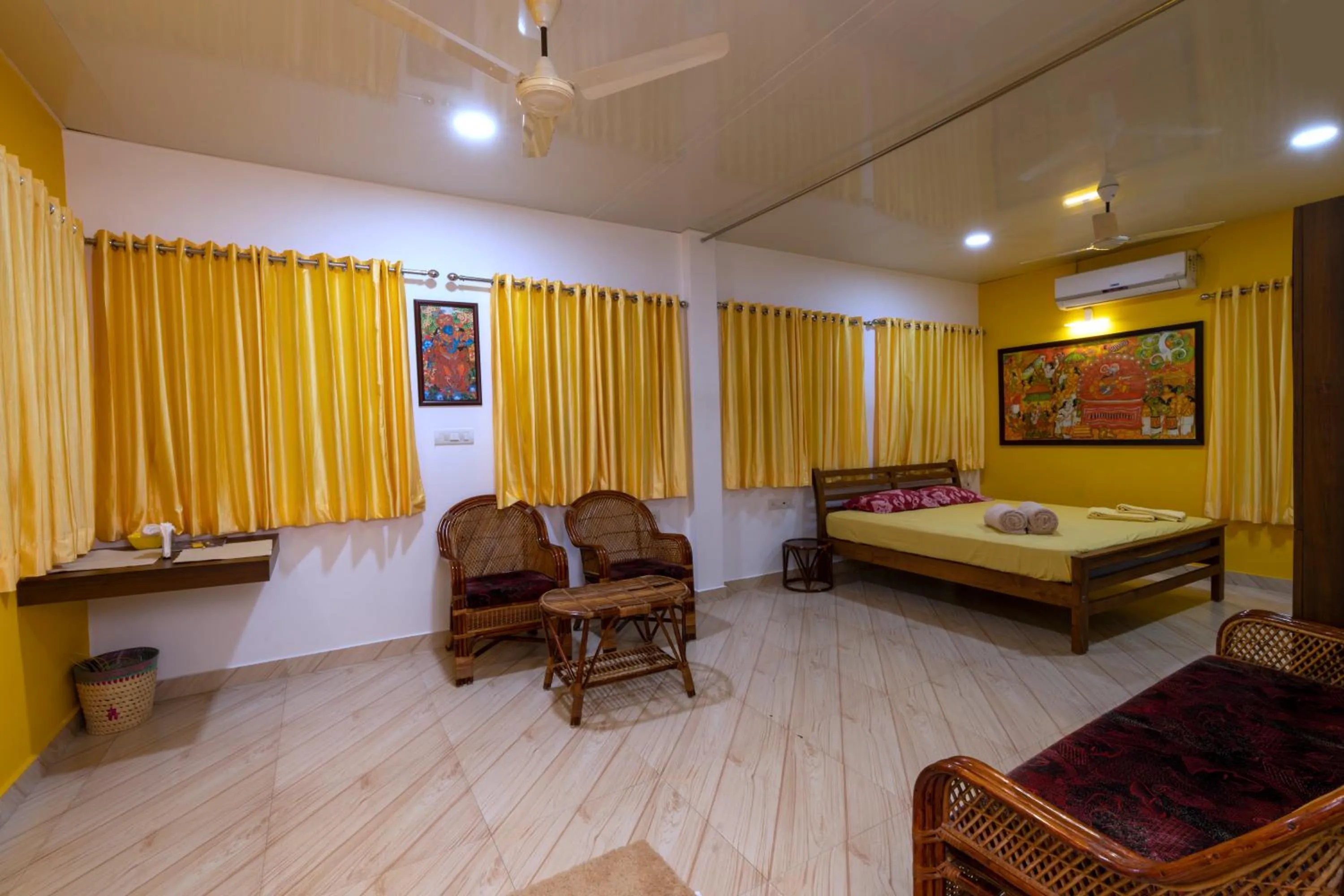 Living room, Bed in Vasudevam Premium Suites