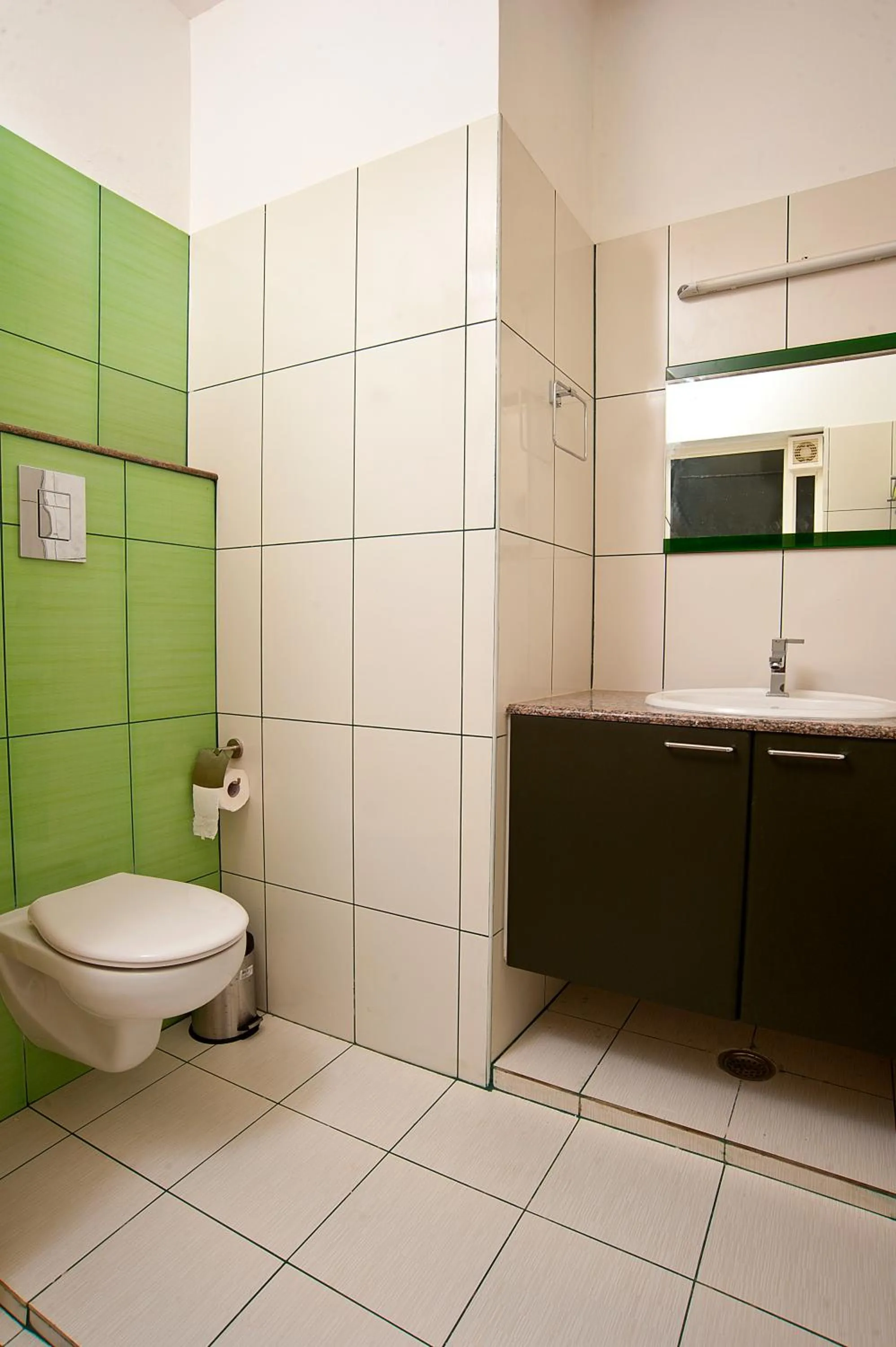 Toilet in Vasudevam Premium Suites