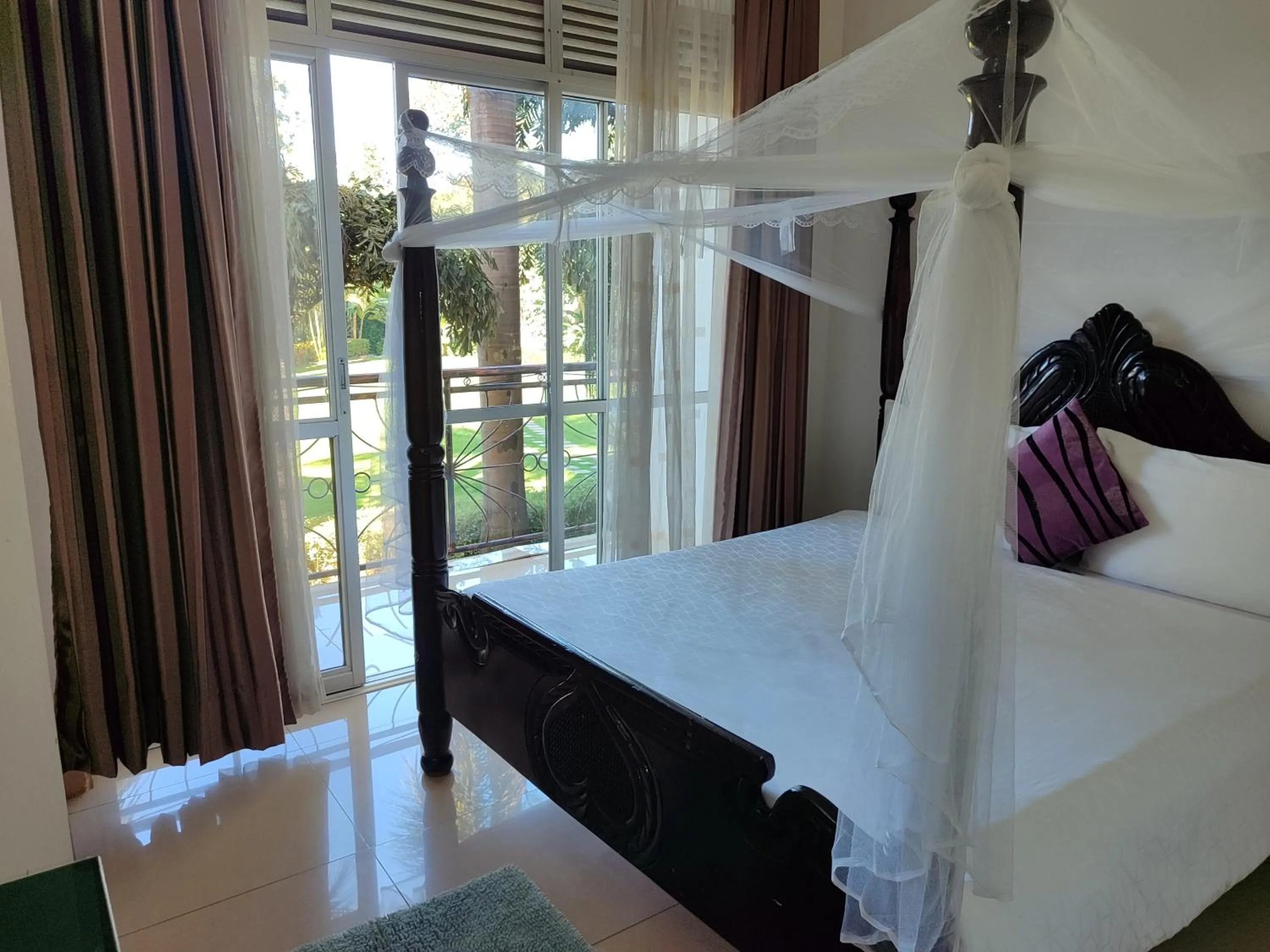 Bed in Garden Courts Hotel Masaka