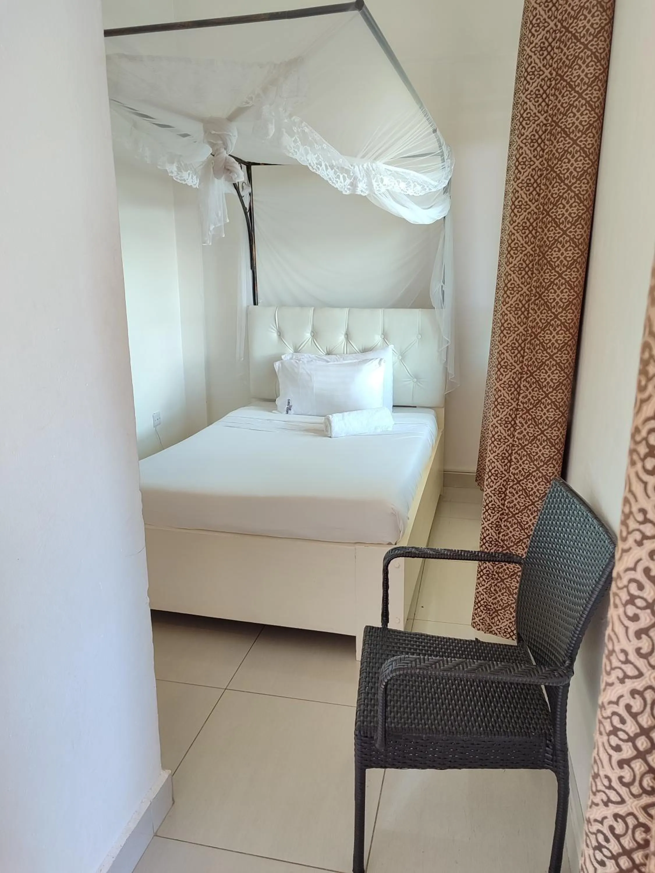 Bed in Garden Courts Hotel Masaka
