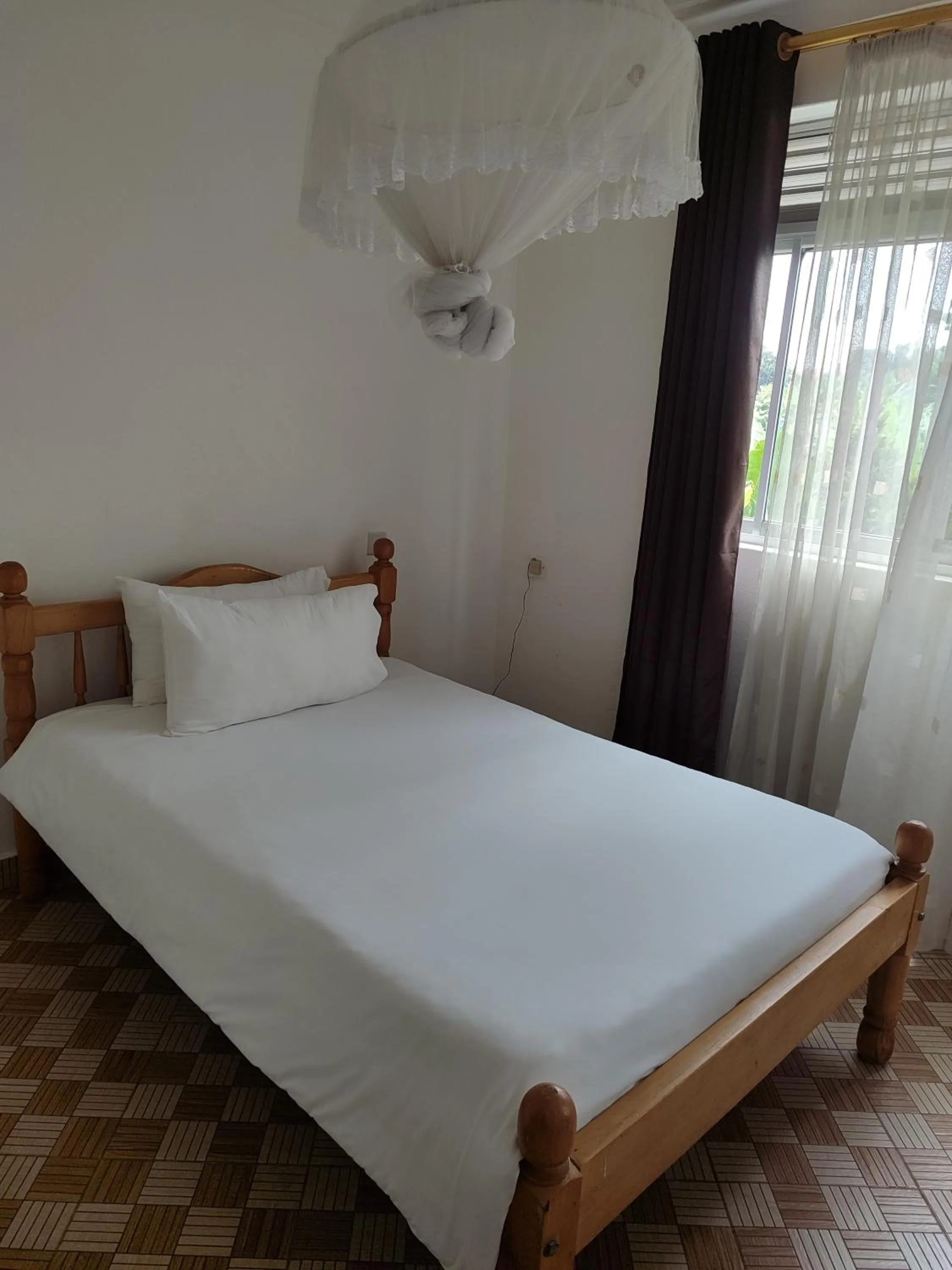 Bed in Garden Courts Hotel Masaka