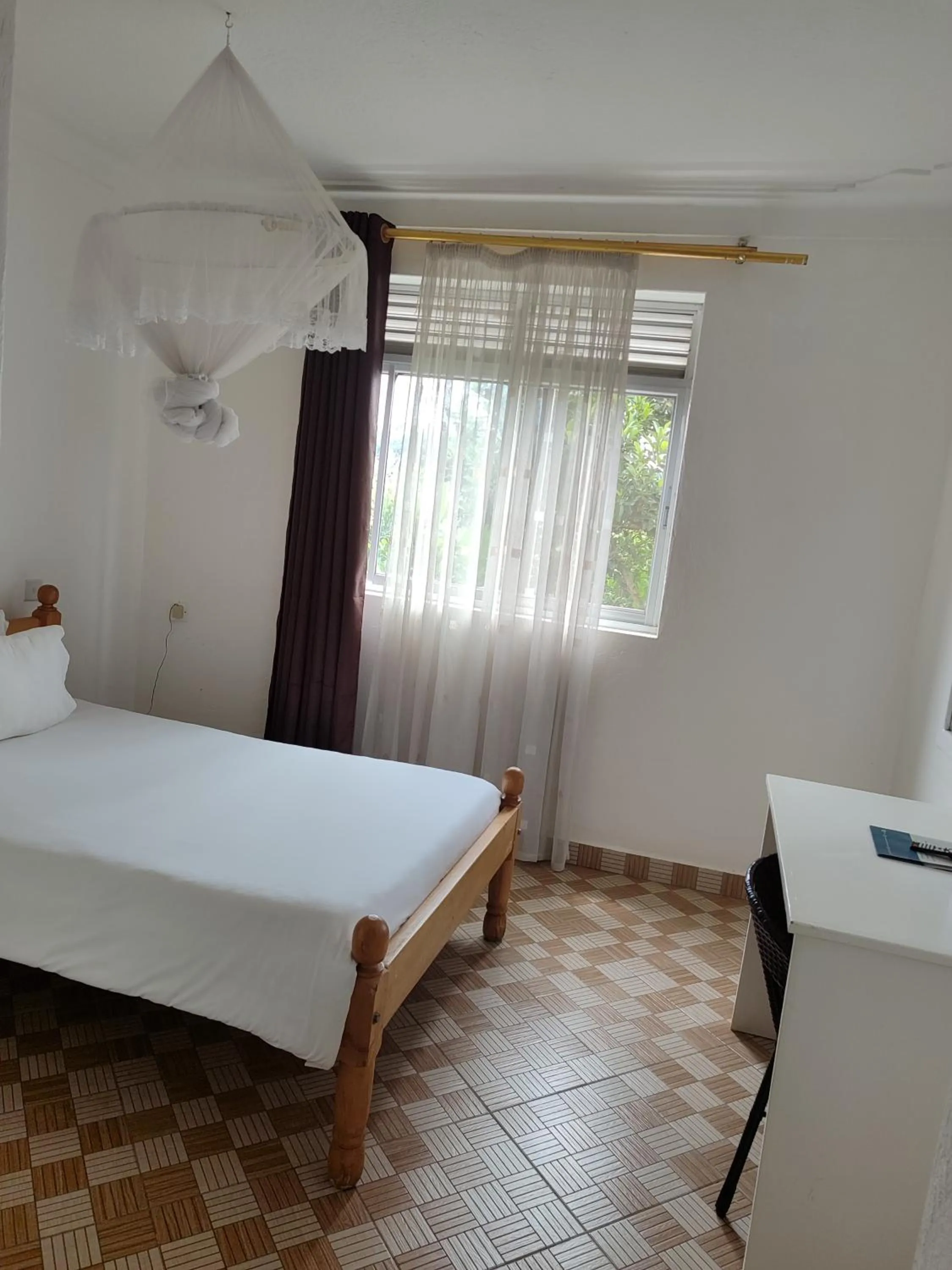 Bedroom in Garden Courts Hotel Masaka