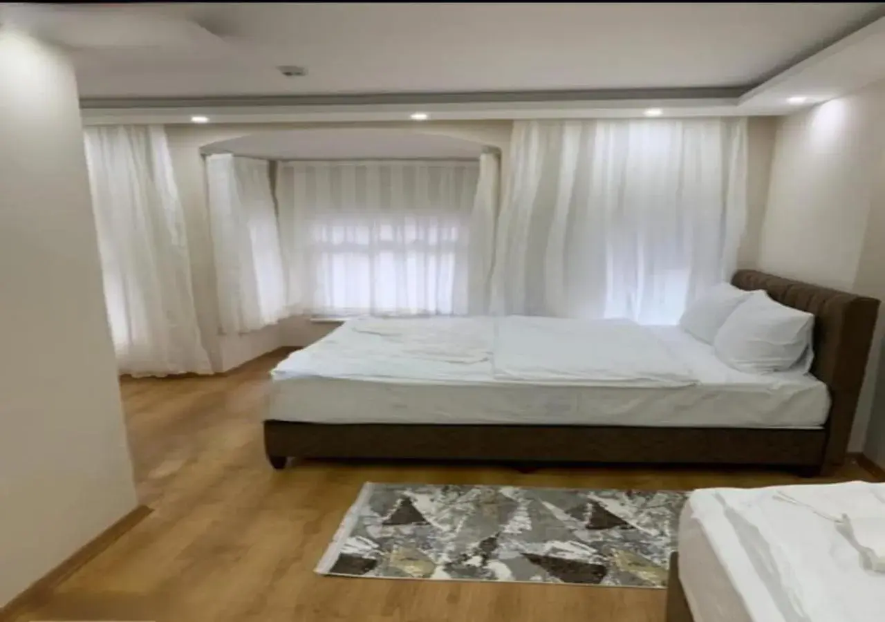 Bed in BLUE ROYAL HOTEL Bed in BLUE ROYAL HOTEL