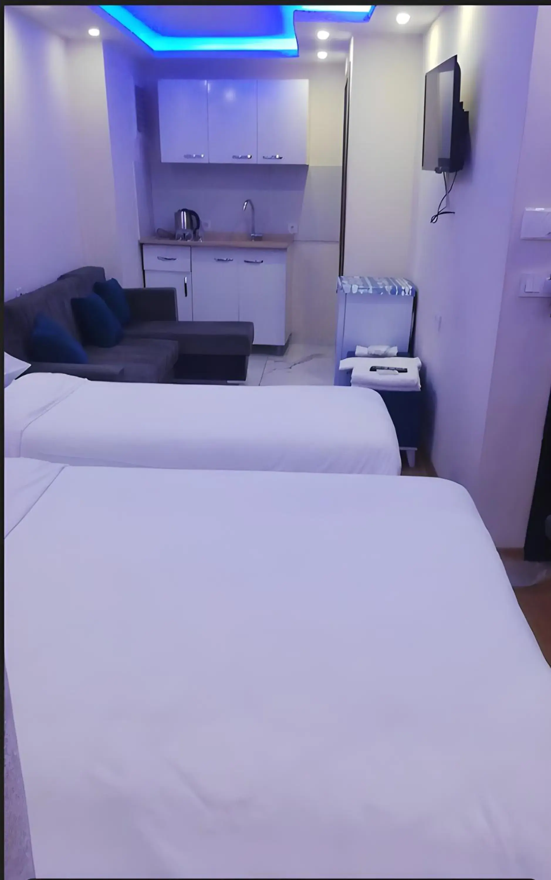 Kitchen or kitchenette, Bed in BLUE ROYAL HOTEL Kitchen or kitchenette, Bed in BLUE ROYAL HOTEL