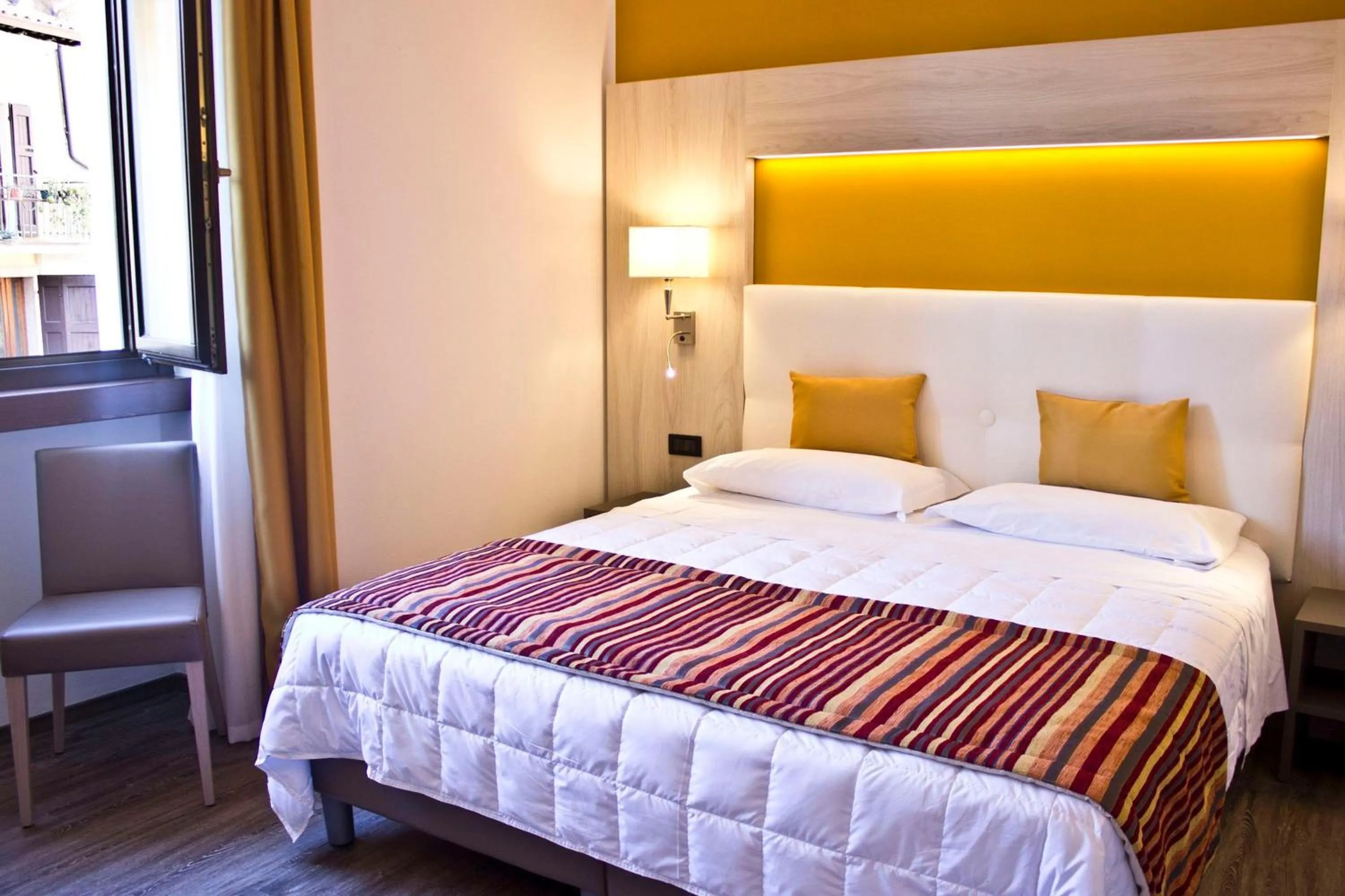 Bed in Hotel Dolomiti