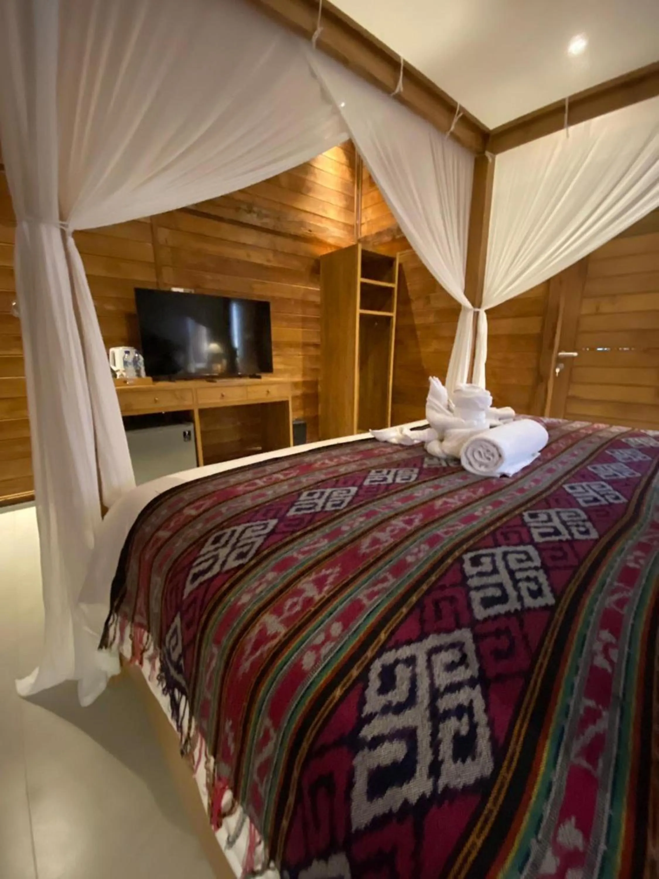 Bed in Kubu Sakian Villa and Restaurant Sidemen