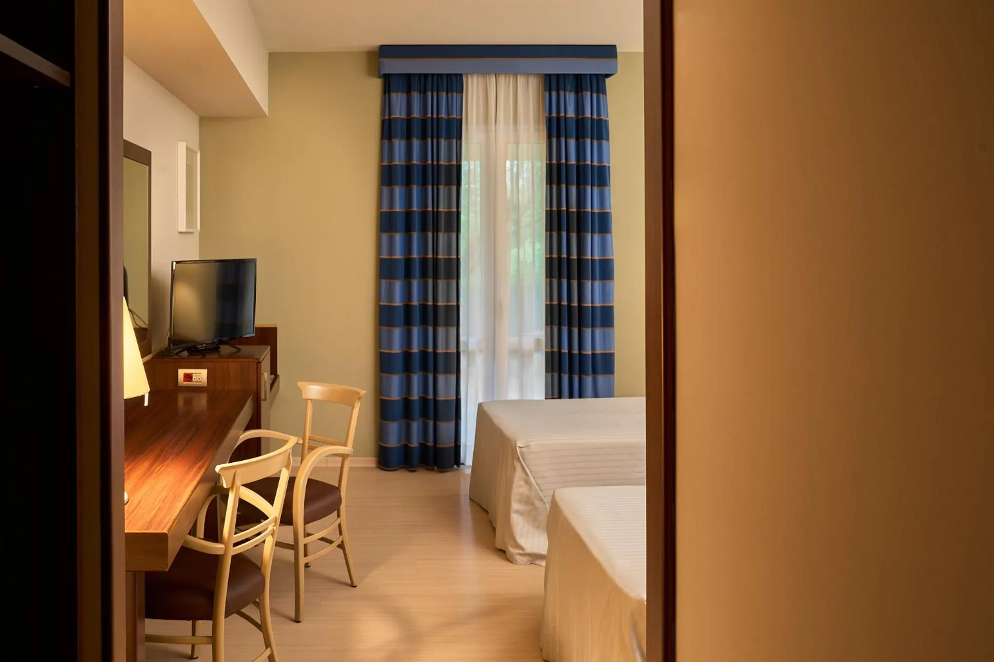 Bed in Delfina Palace Hotel