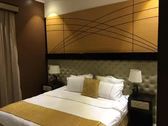 Bed in Taleen Serviced Apartments AlSahafa Bed in Taleen Serviced Apartments AlSahafa