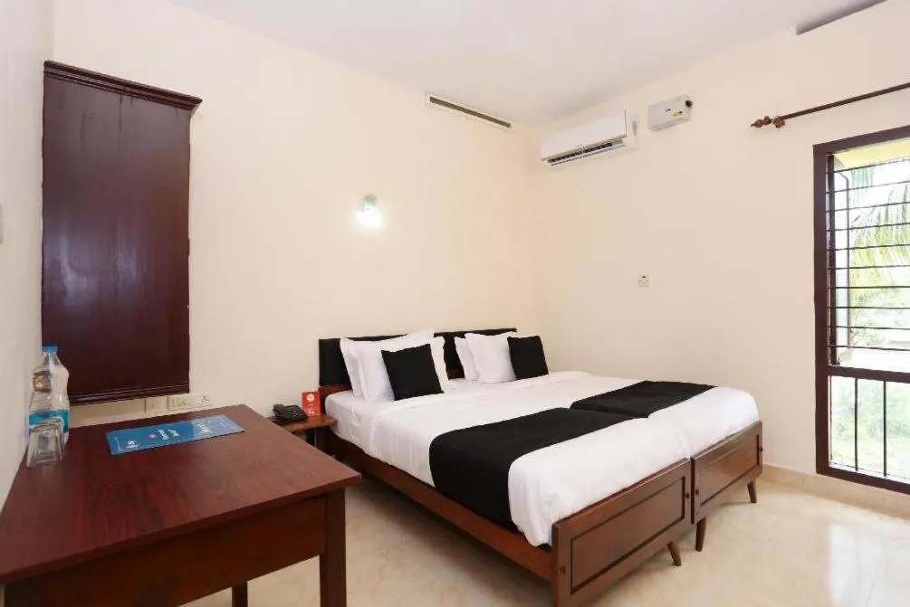 Photo of the whole room, Bed in Hotel Sunday - Townhouse Club Airport Trivandrum