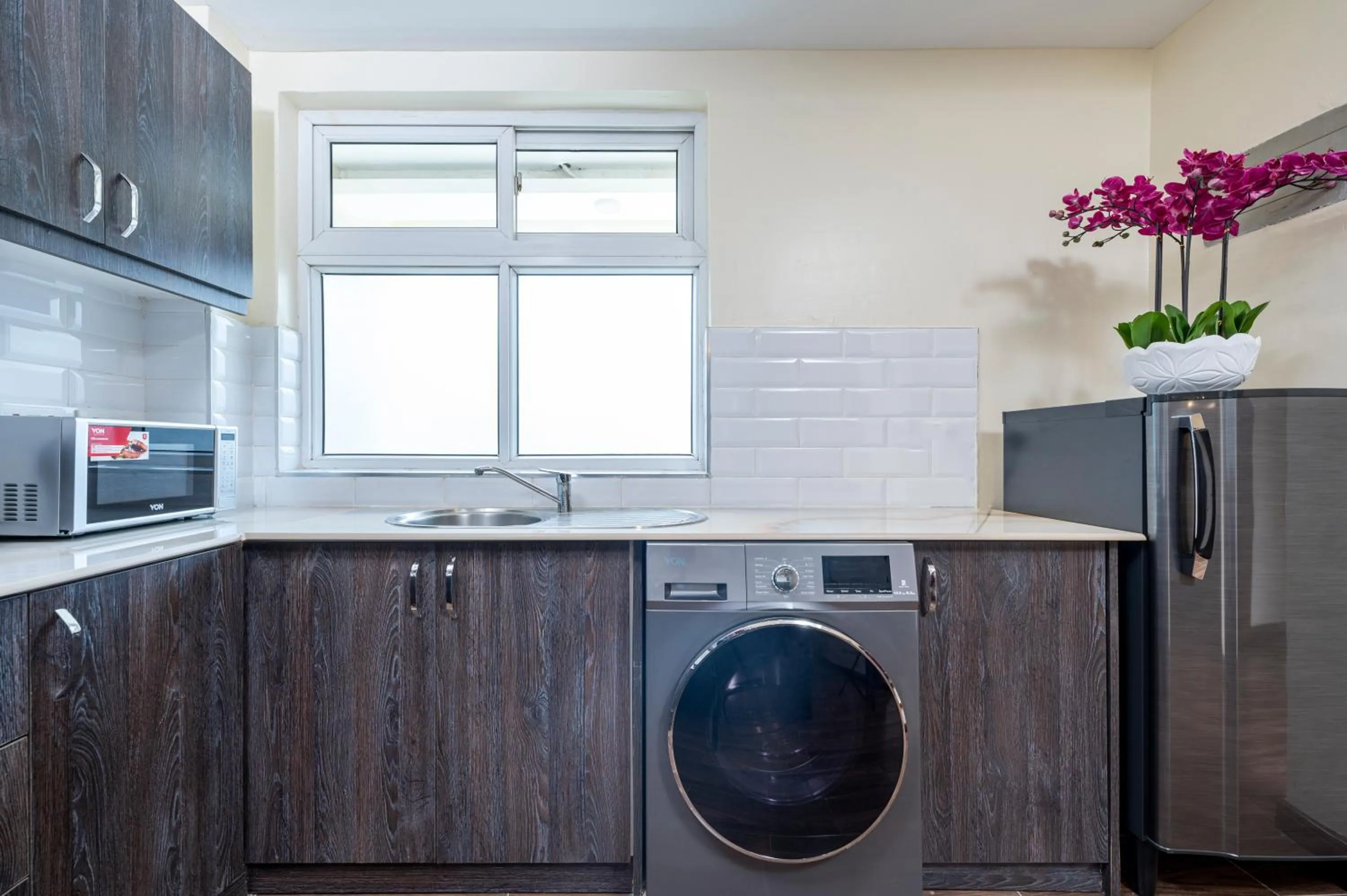 washing machine in Roma Court Serviced Apartments