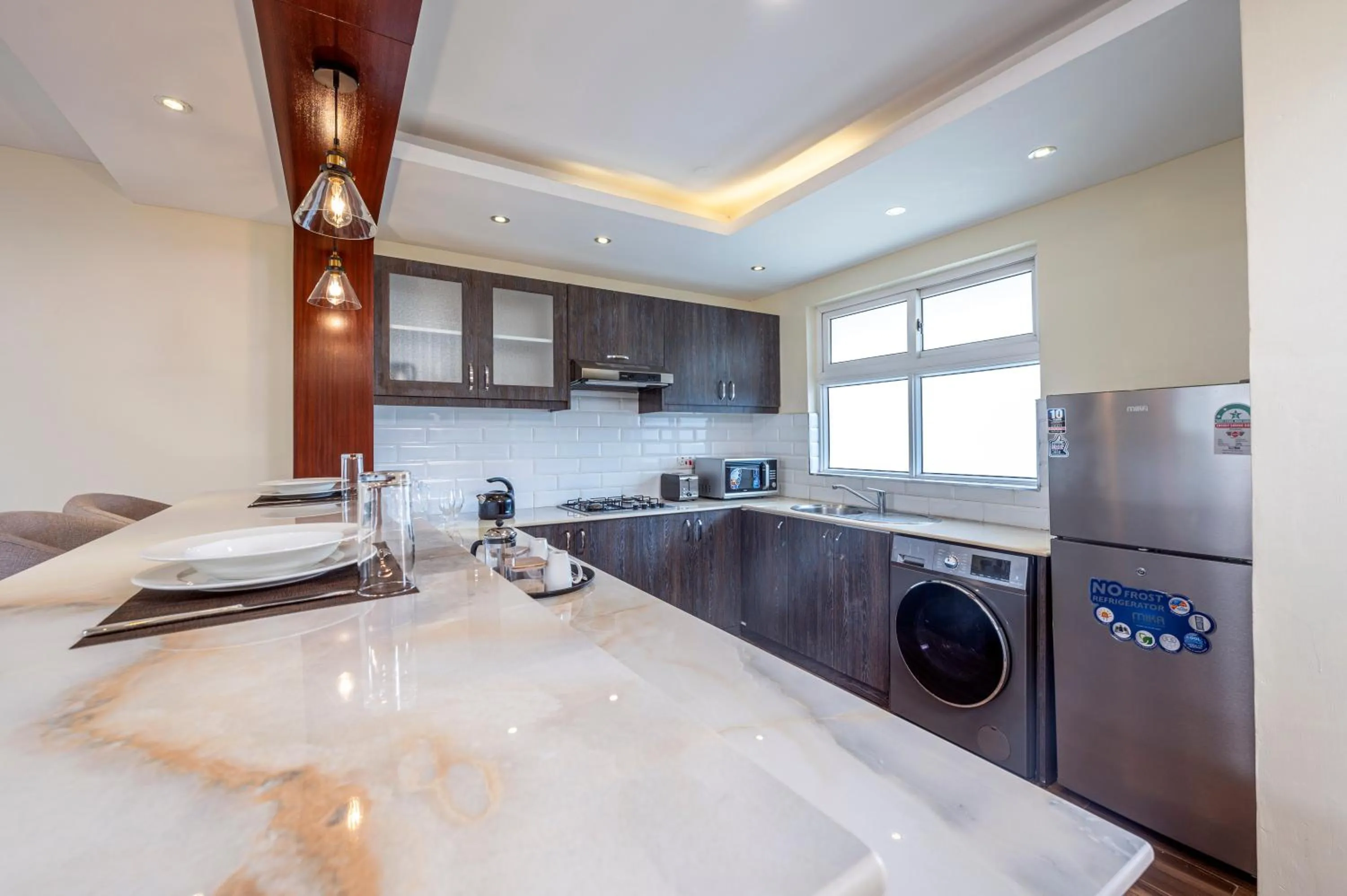 washing machine in Roma Court Serviced Apartments