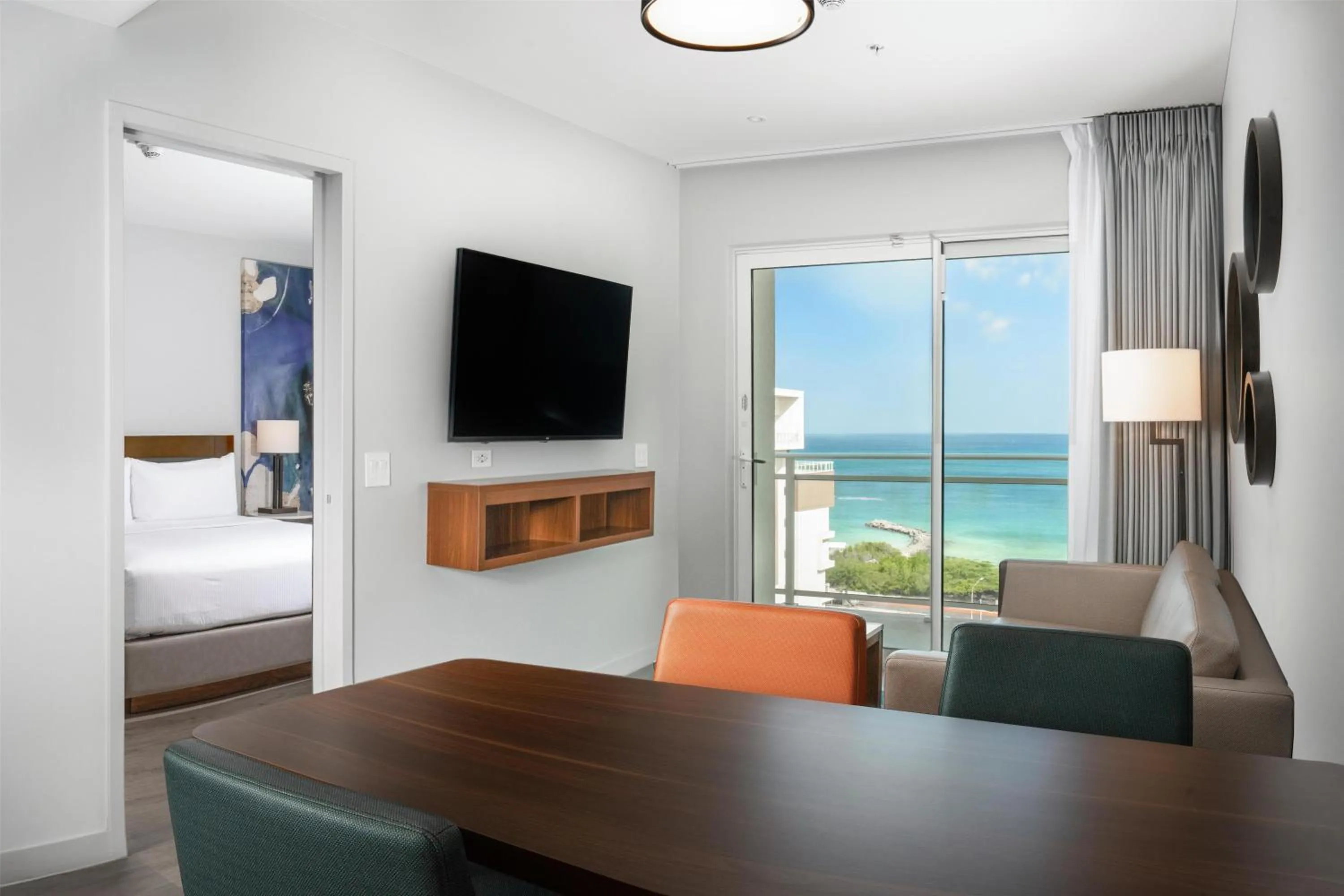 Living room, Bed in Embassy Suites By Hilton Aruba Beach Resort