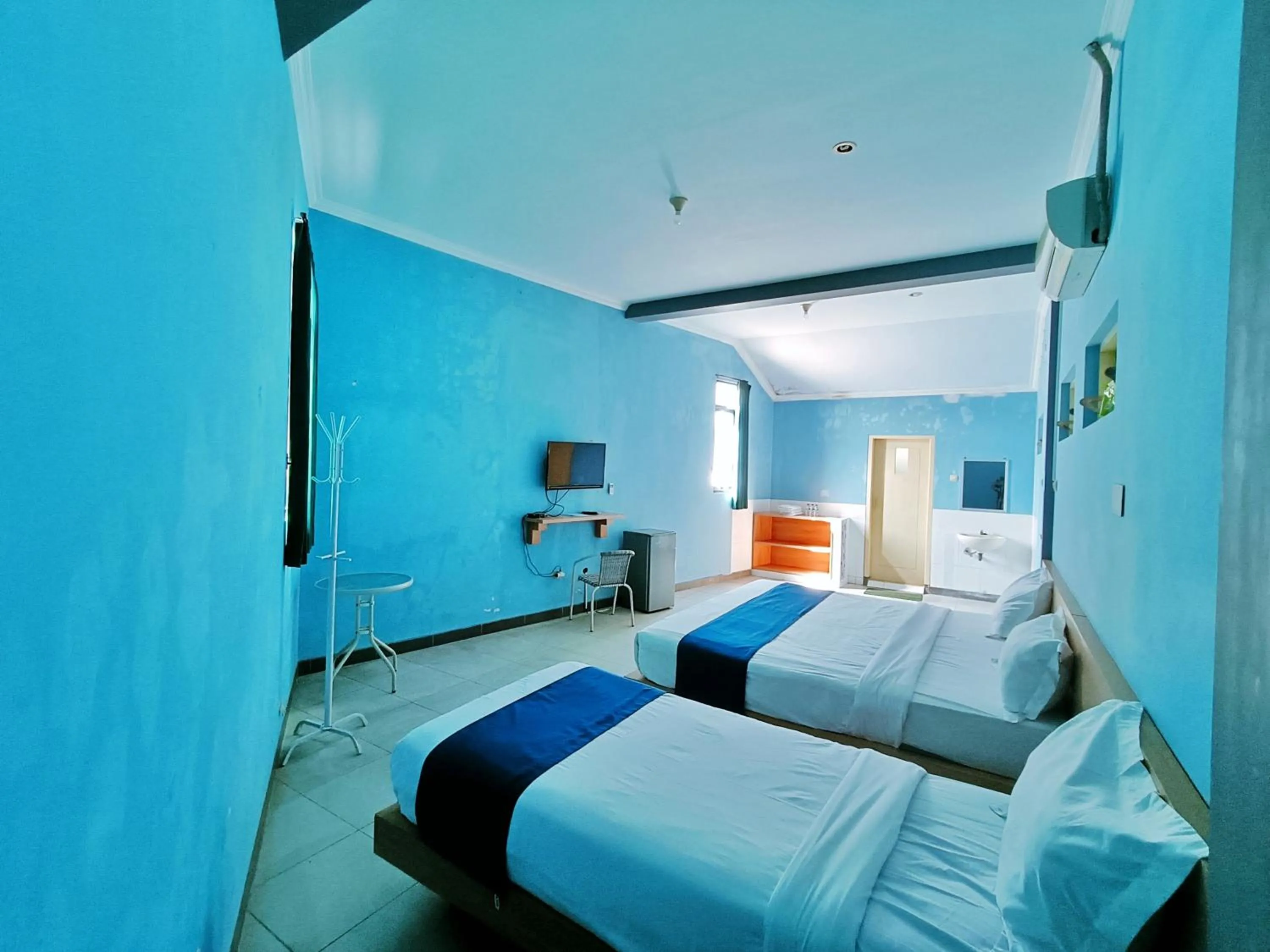 Bed in Candi Panggung Family Guest House Syariah