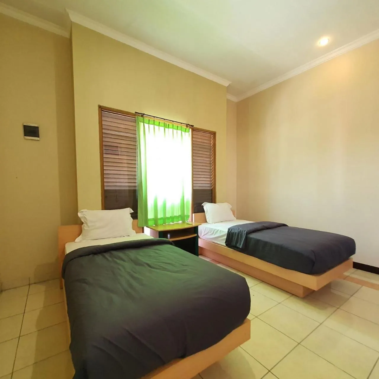 Bed in Candi Panggung Family Guest House Syariah