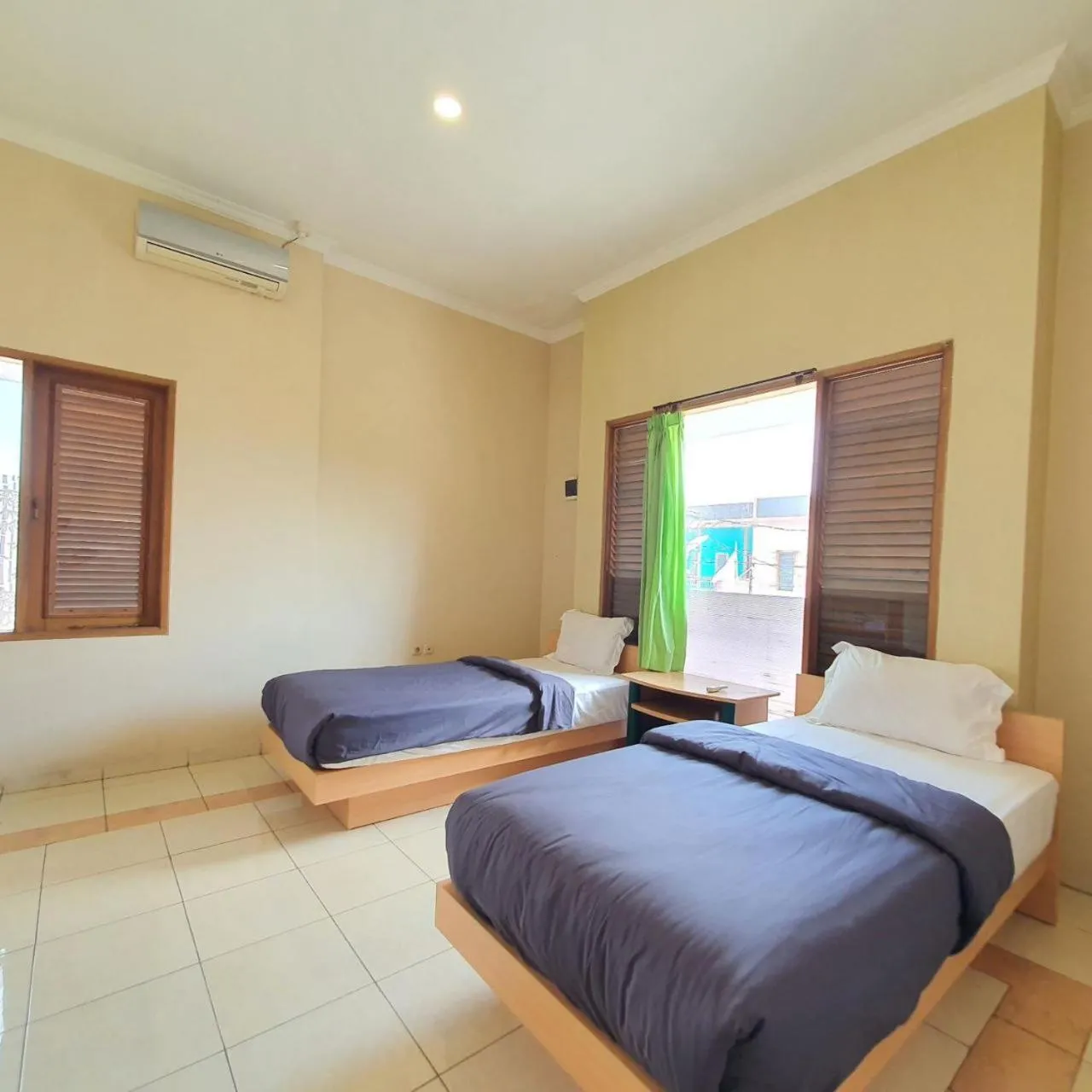 Bed in Candi Panggung Family Guest House Syariah