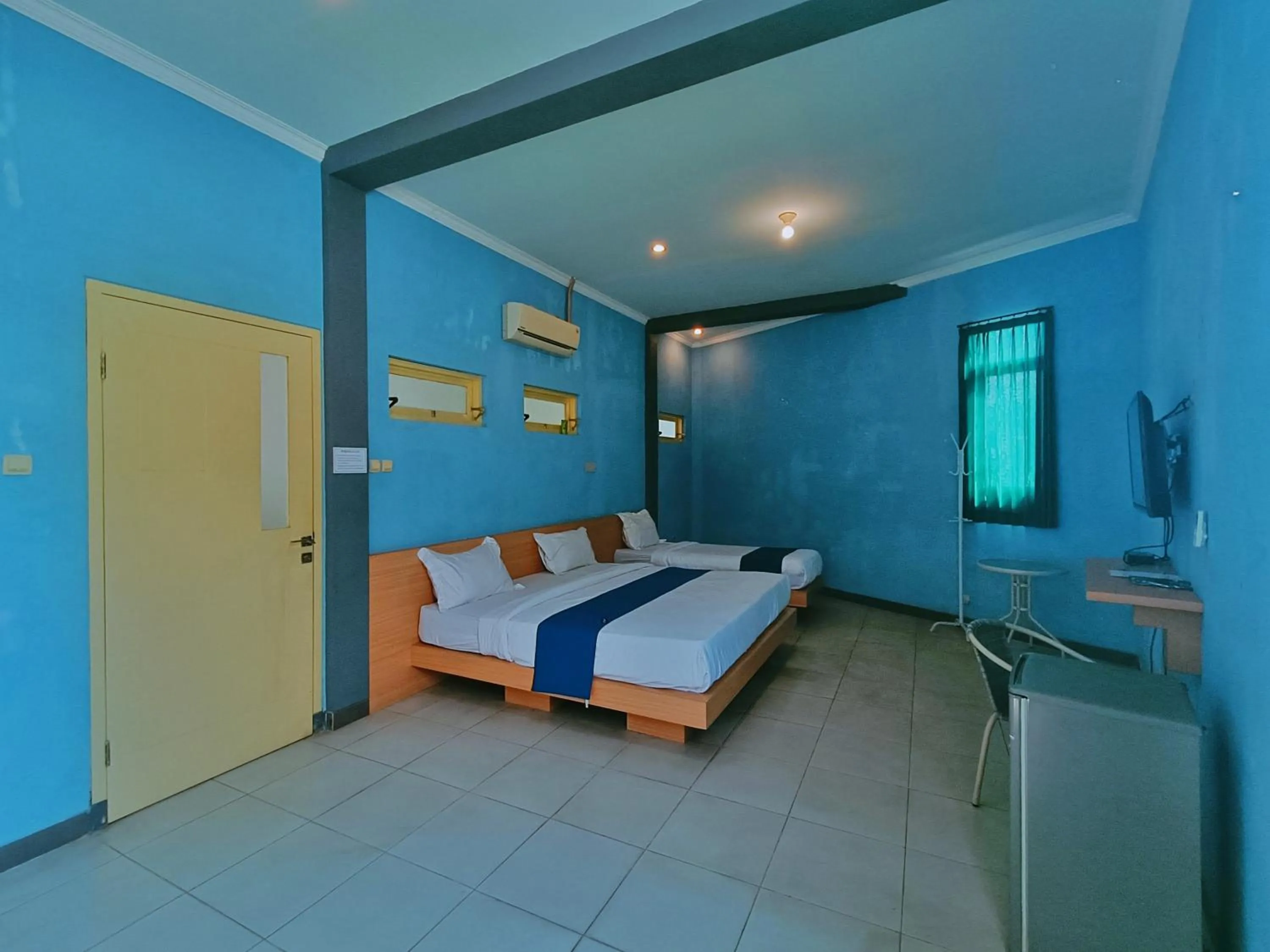 Bed in Candi Panggung Family Guest House Syariah