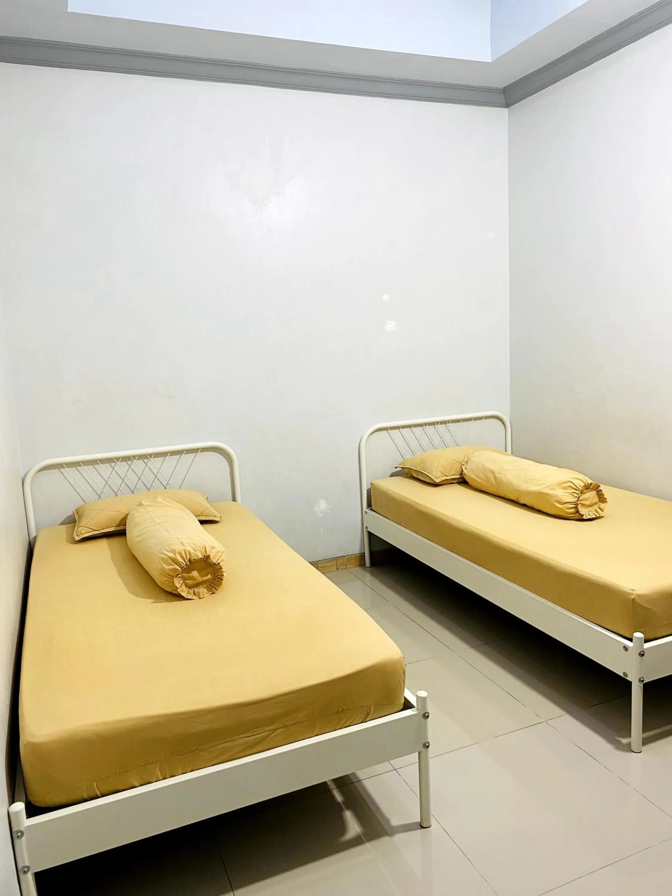 Bed in IB Homestay Syariah by Ecommerceloka