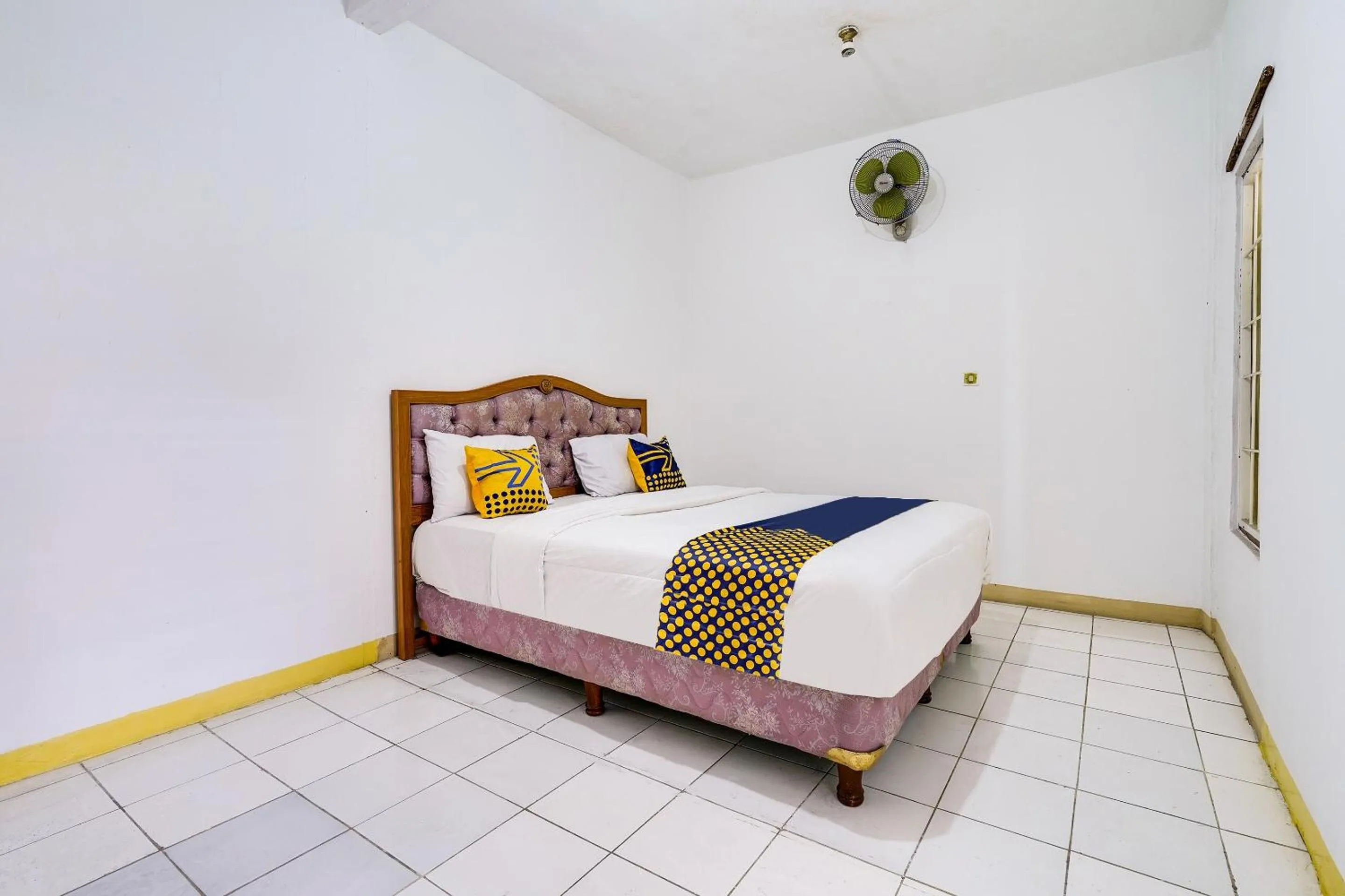 Bedroom in OYO 91546 Dewi Sudirman Homestay