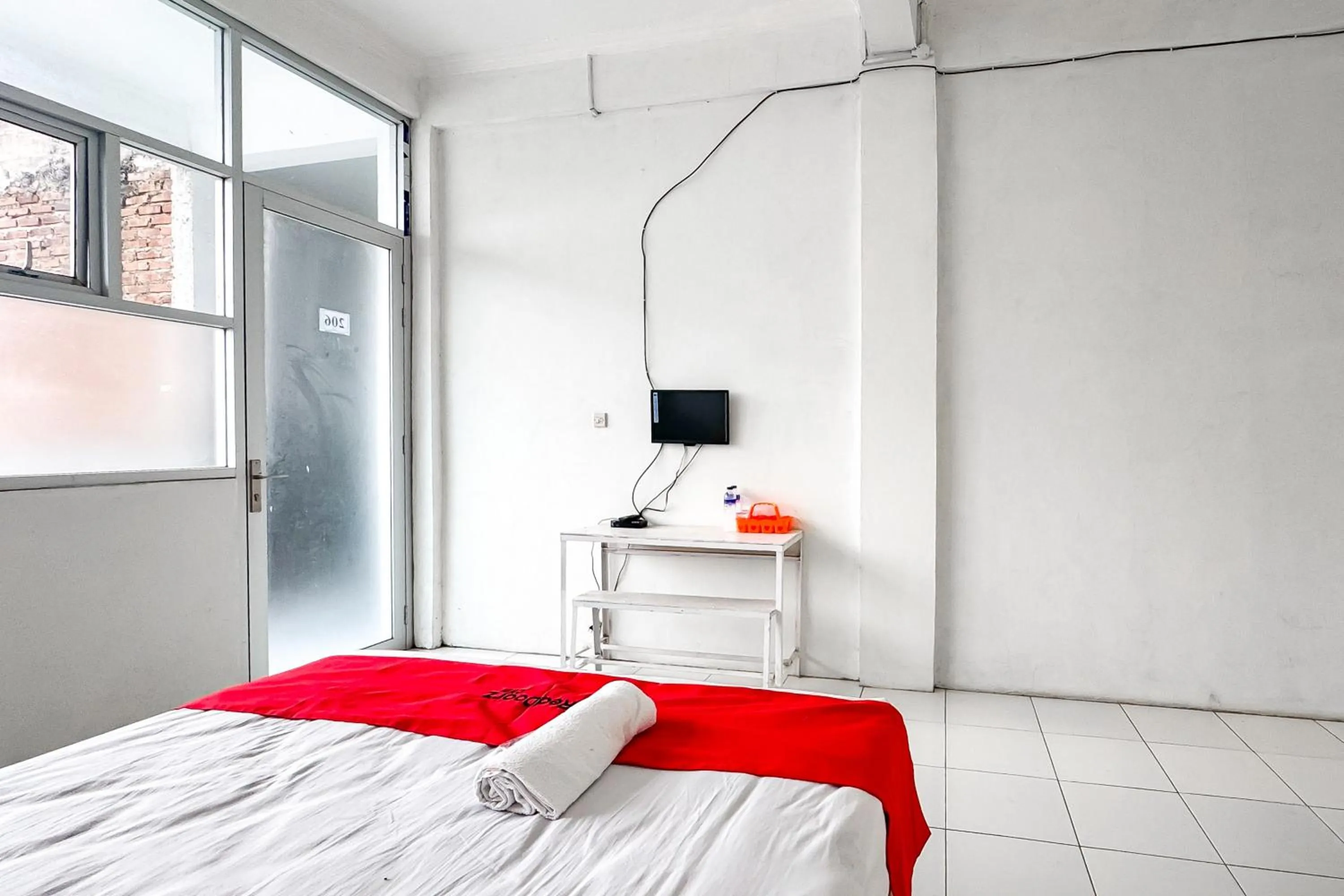 Bedroom, Bed in RedDoorz Syariah at Neu Hostel Cisarua Lembang