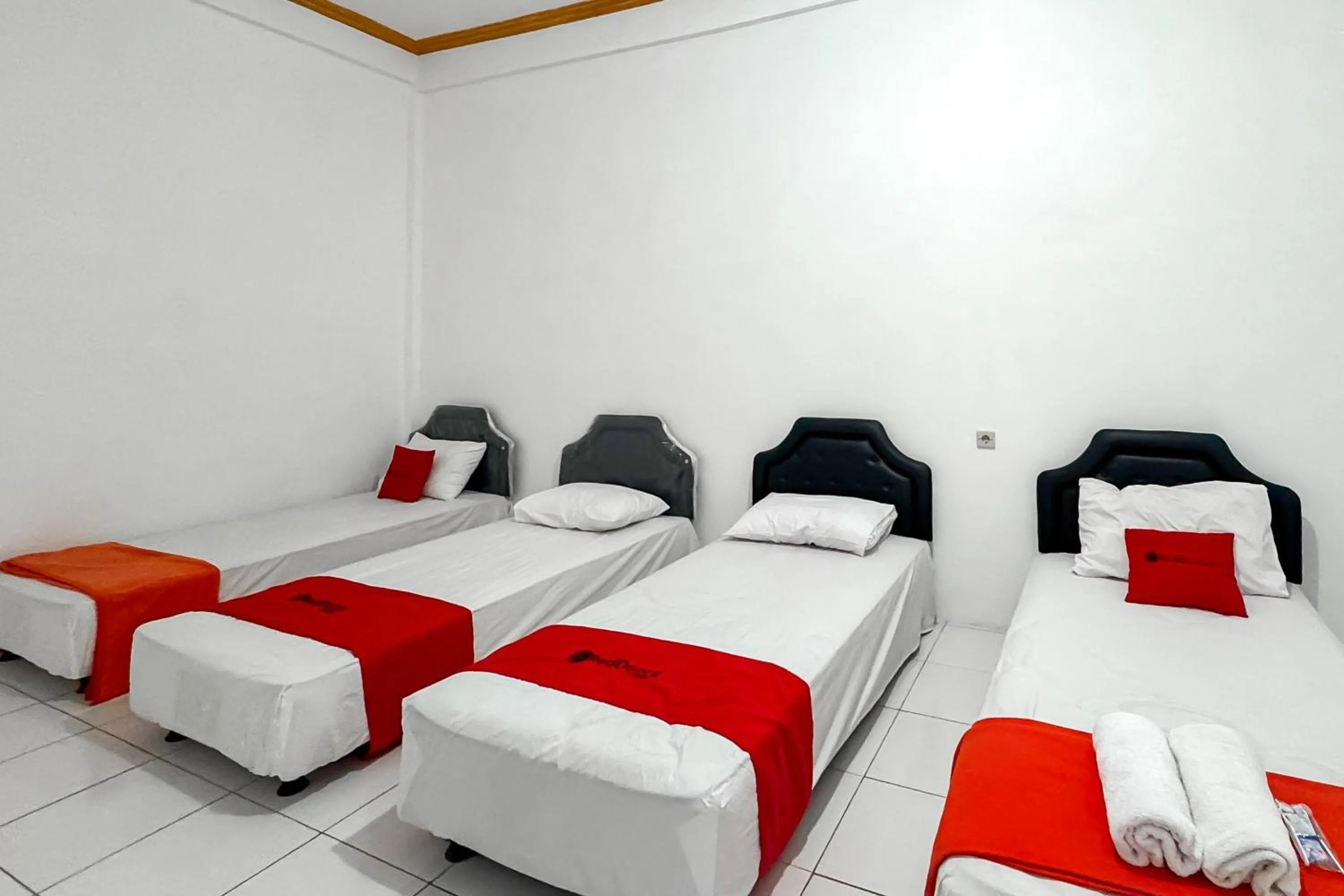 Bedroom, Bed in RedDoorz Syariah at Neu Hostel Cisarua Lembang