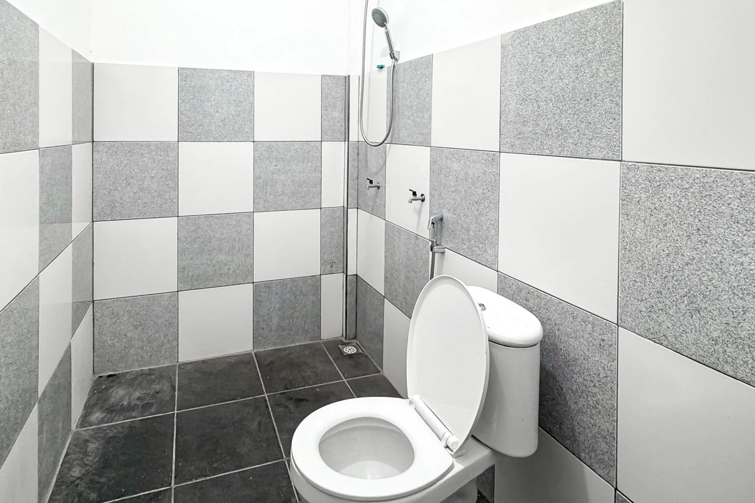 Bathroom in RedDoorz Syariah at Neu Hostel Cisarua Lembang