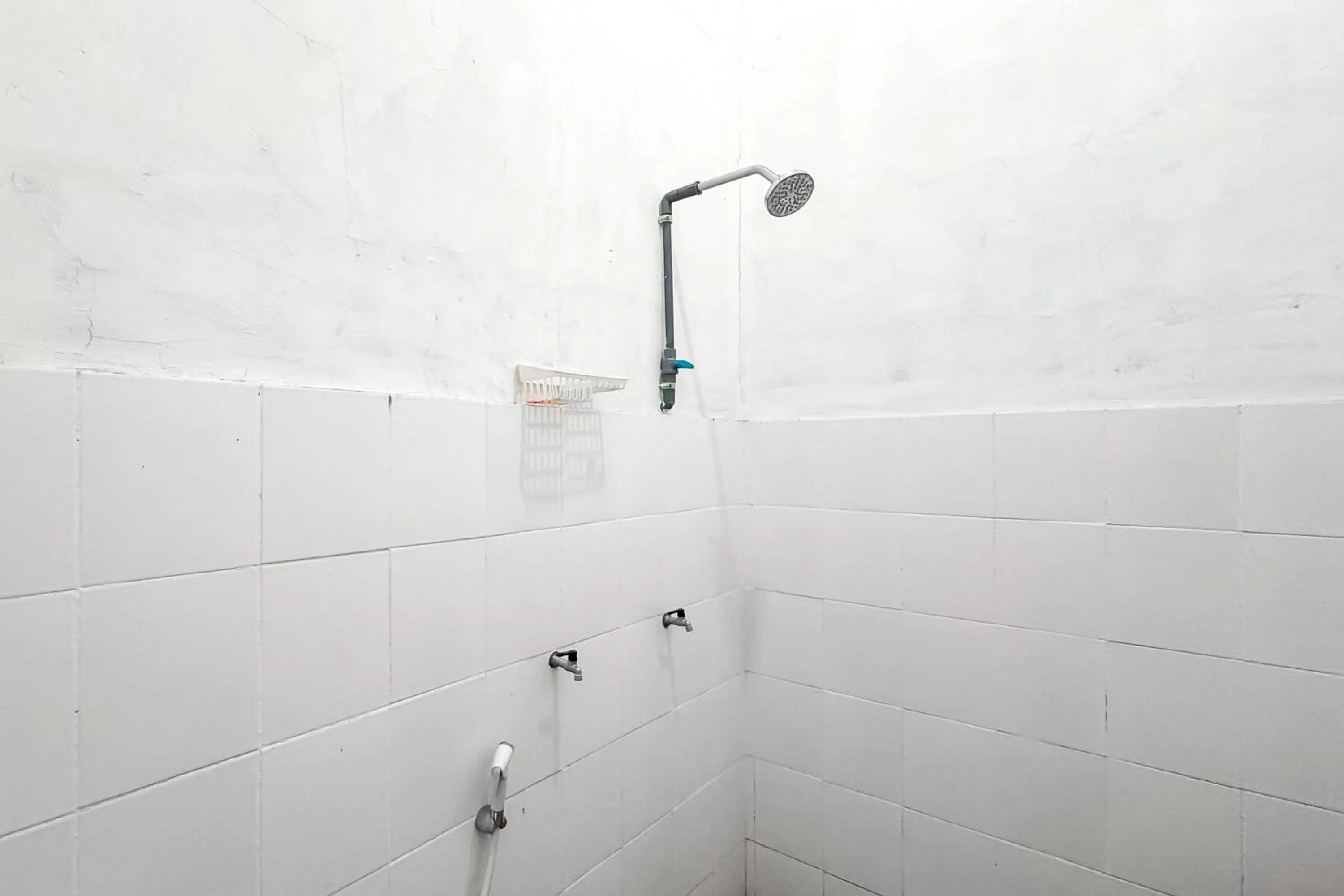 Bathroom in RedDoorz Syariah at Neu Hostel Cisarua Lembang