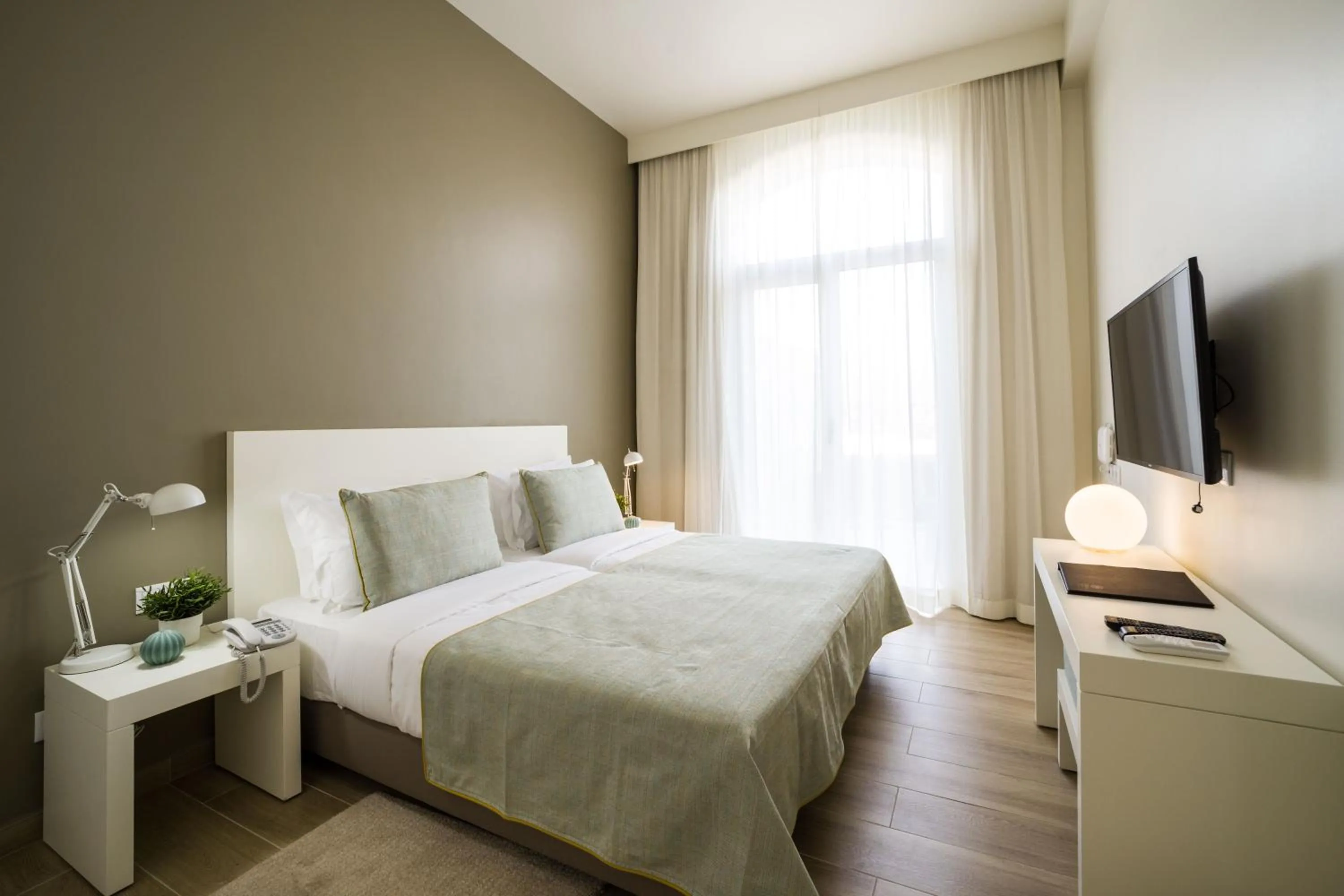 Bed in Oasis Tarrafal Alfandega Suites