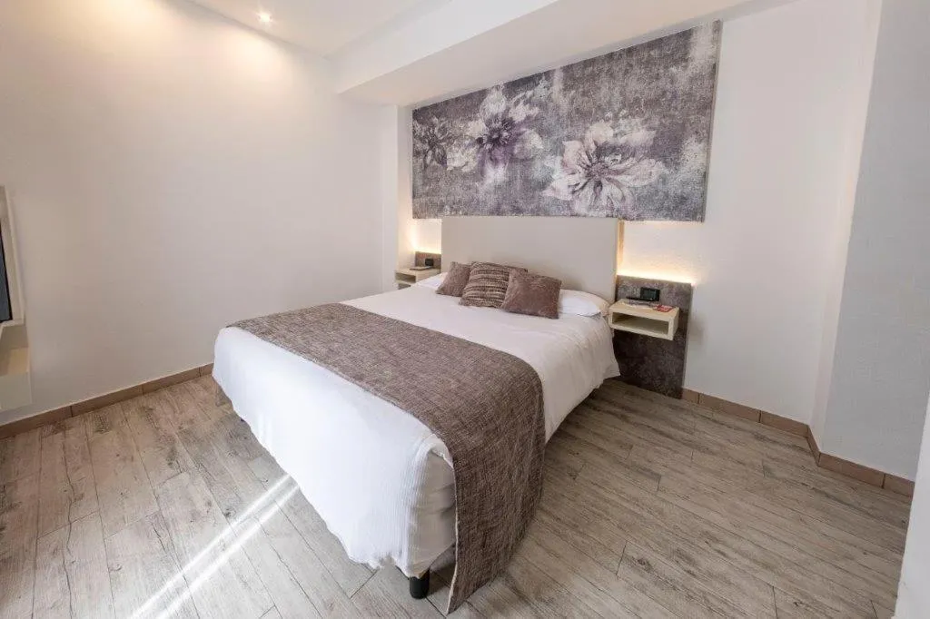 Bed in Hotel Le Palme