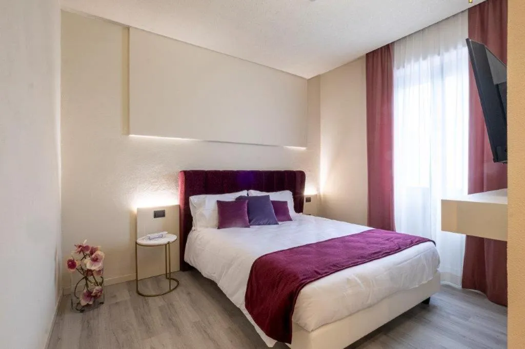 Bed in Hotel Le Palme