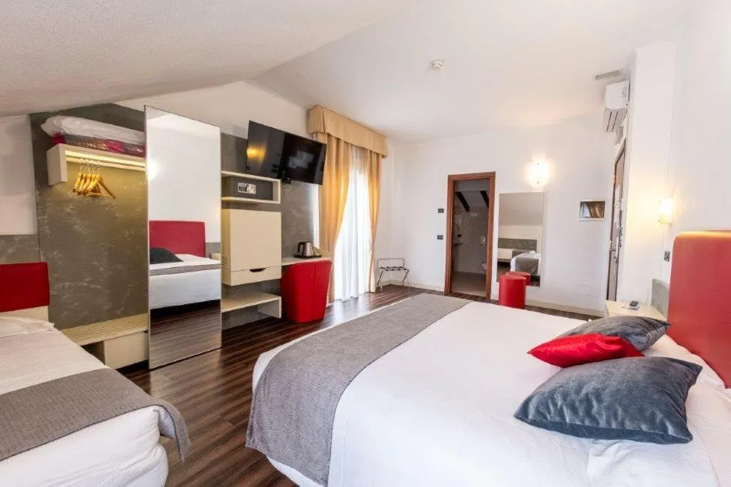 Bed in Hotel Le Palme