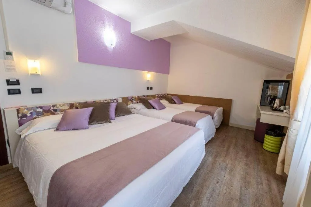 Bed in Hotel Le Palme