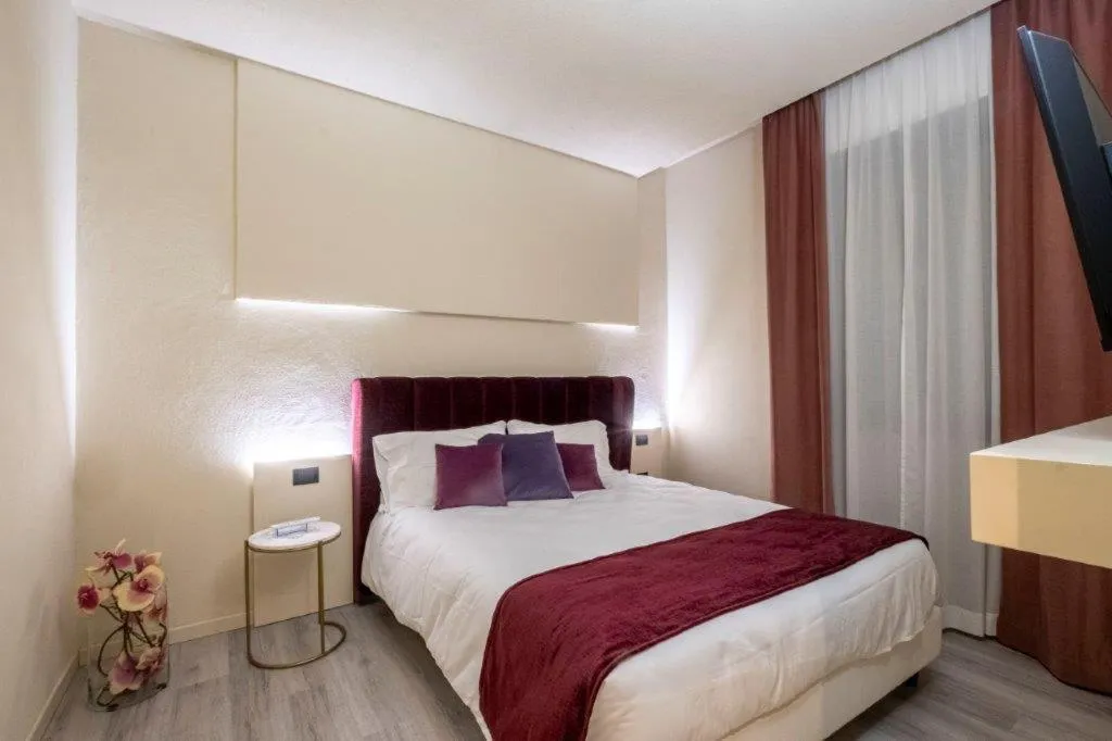 Bed in Hotel Le Palme