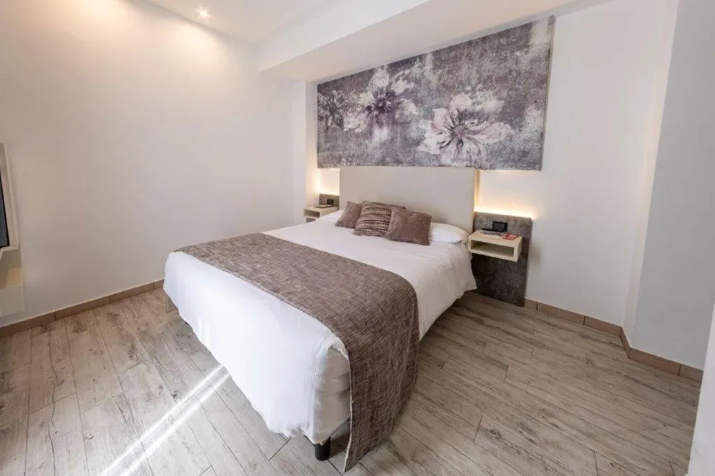 Bed in Hotel Le Palme