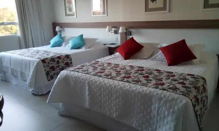 Bed in Lirio D'Água Hotel