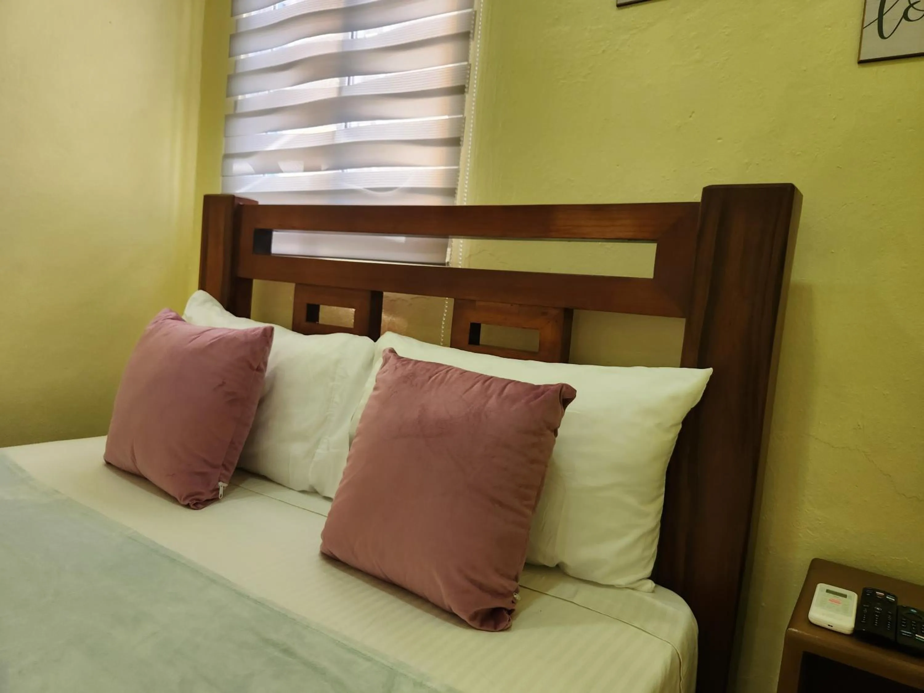 Bed in Apartamentos Melya cerca de la Playa Caleta