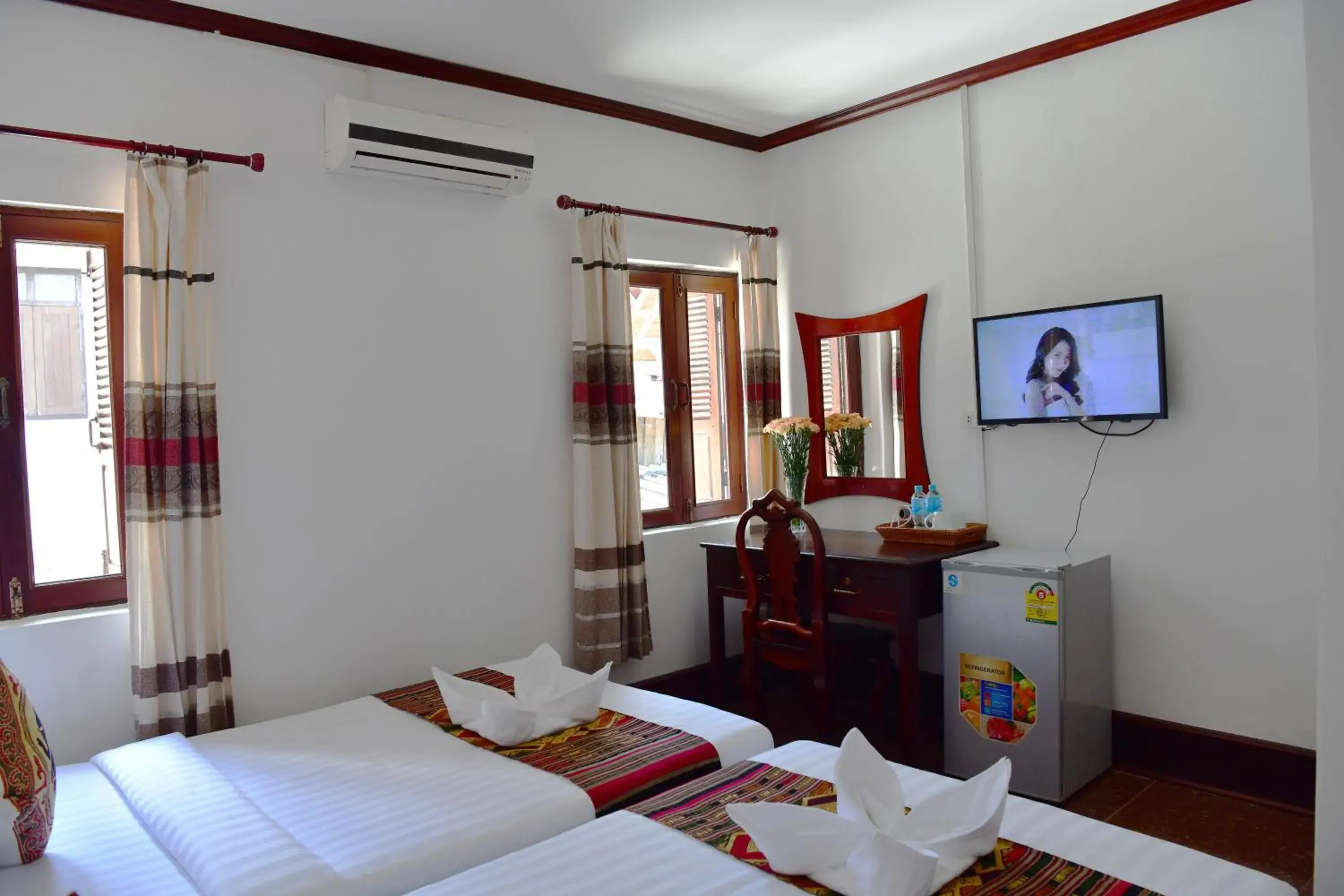 Communal lounge/ TV room, Bed in Thatsaphone Hotel Communal lounge/ TV room, Bed in Thatsaphone Hotel