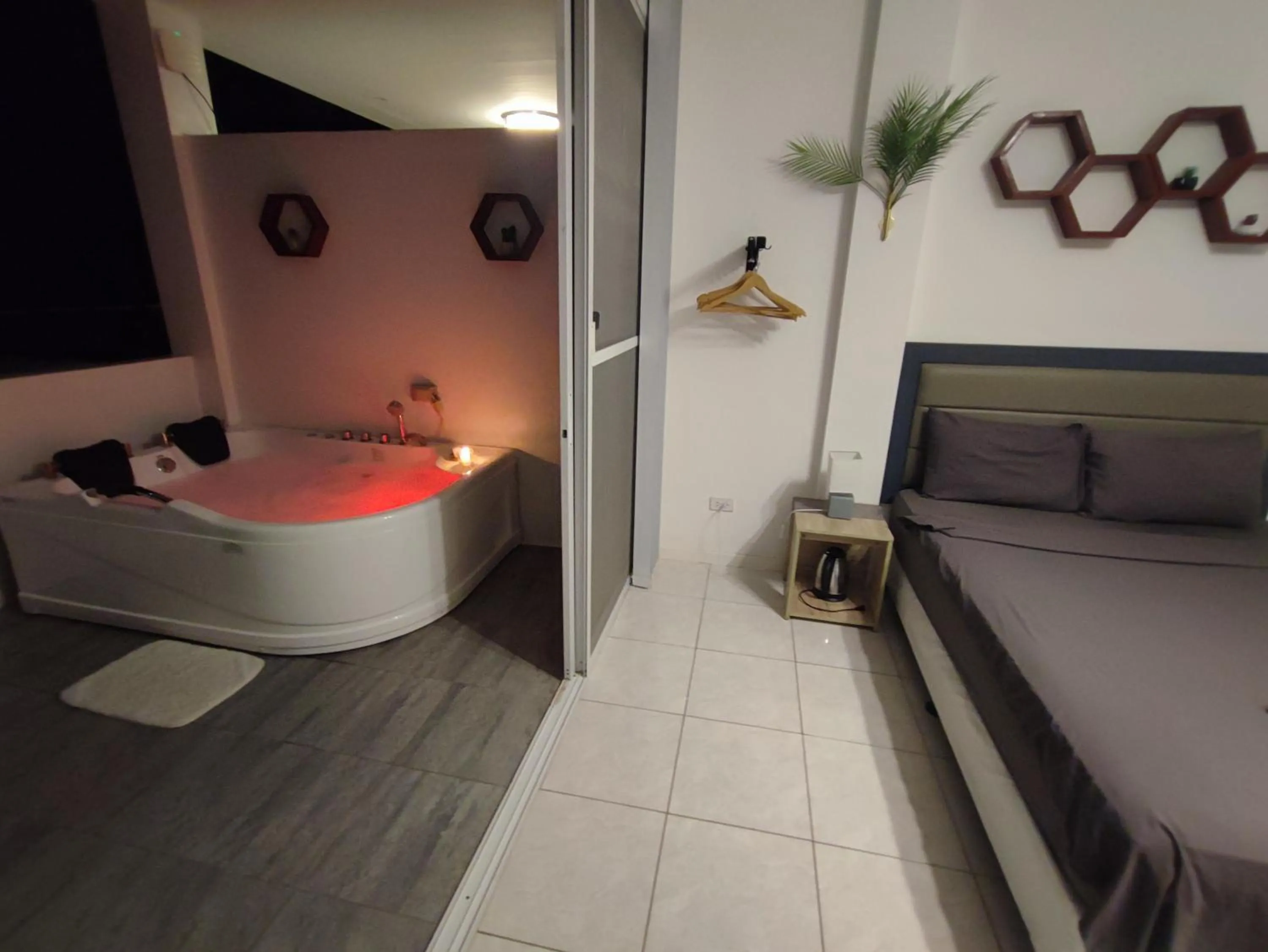 Bed in Bonsai Jacuzzi Suites