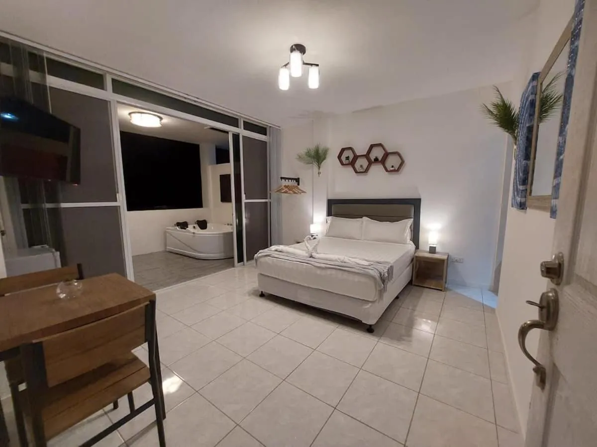 Bed in Bonsai Jacuzzi Suites