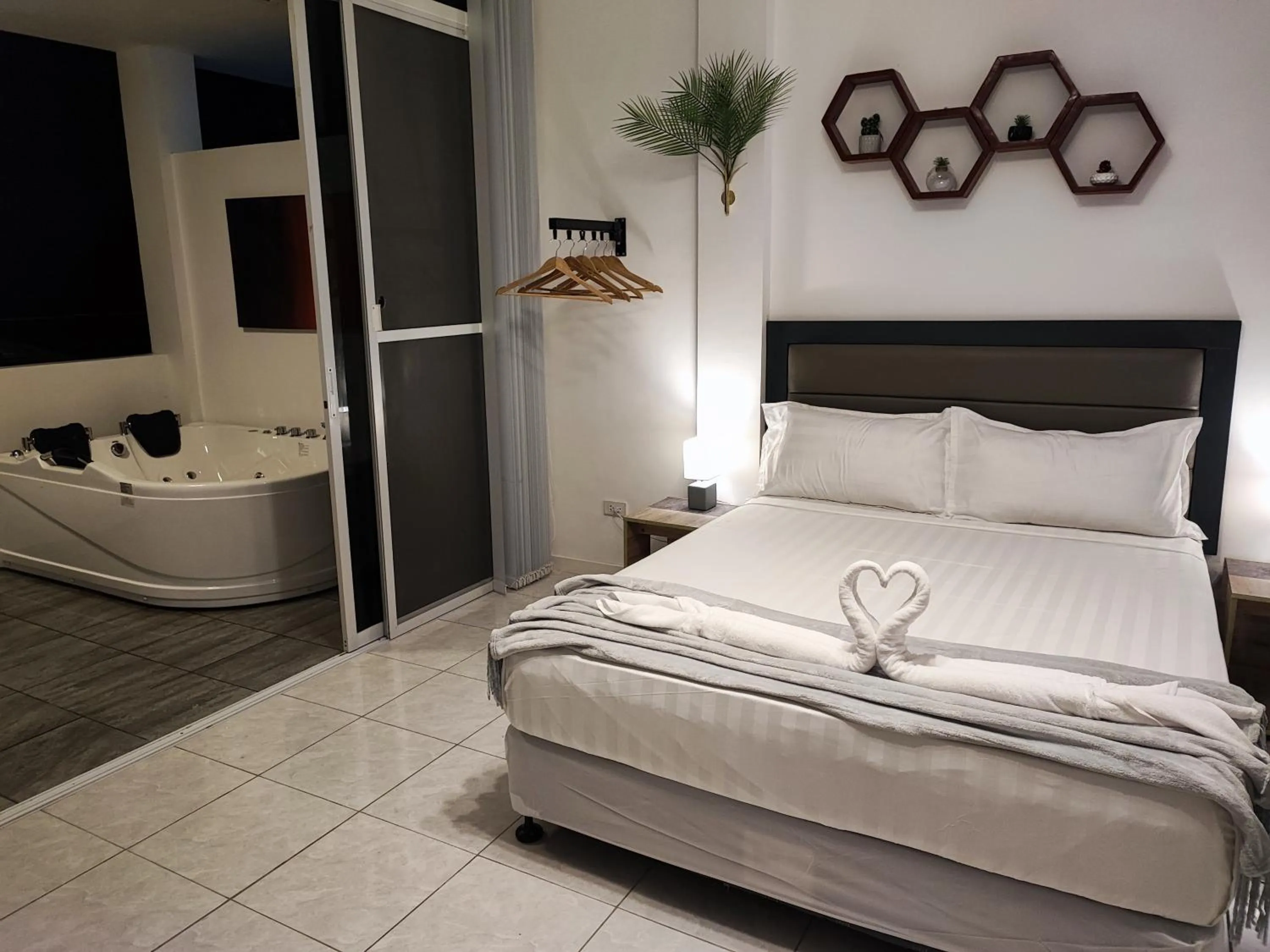 Bed in Bonsai Jacuzzi Suites