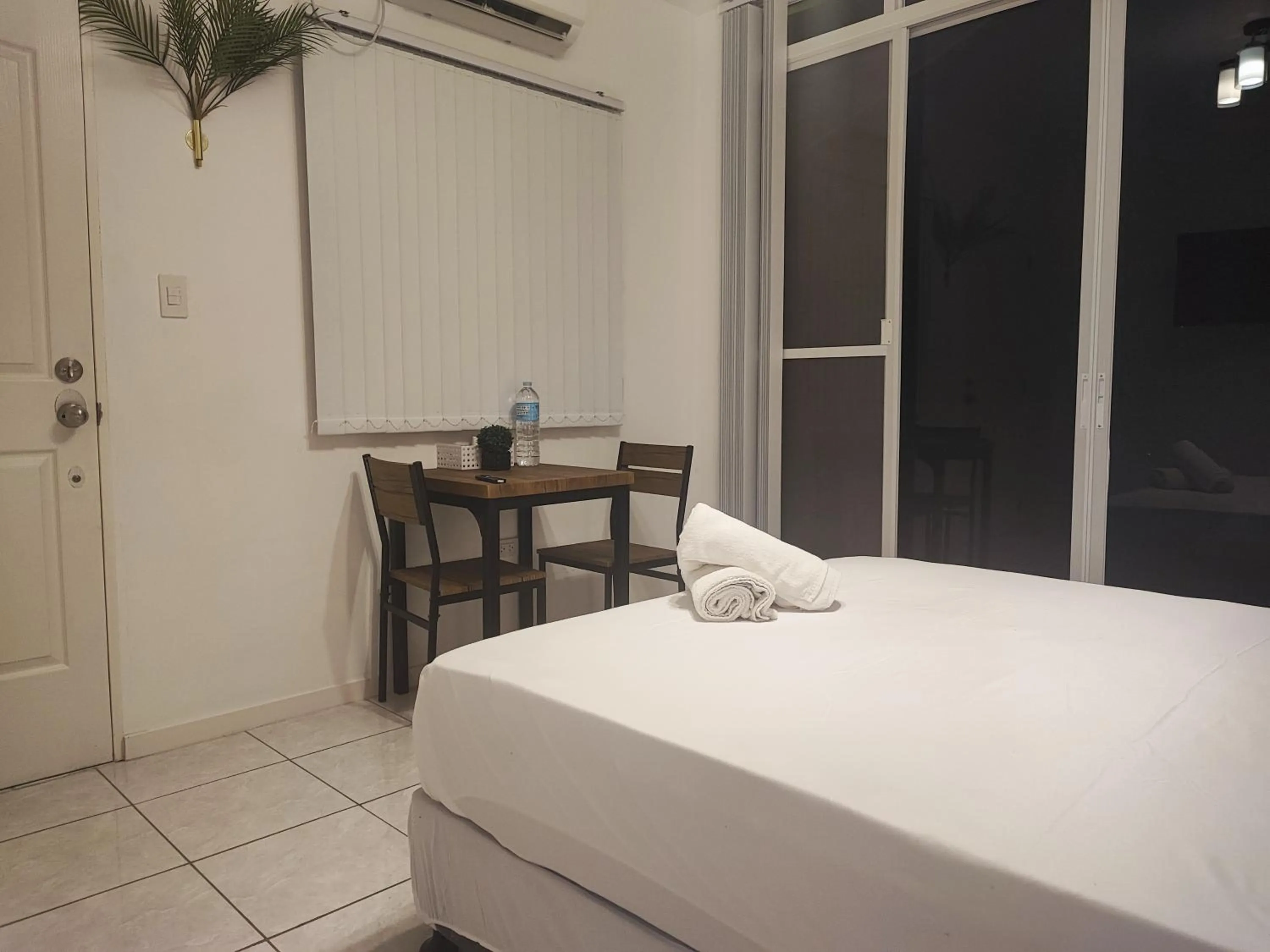 Bed in Bonsai Jacuzzi Suites