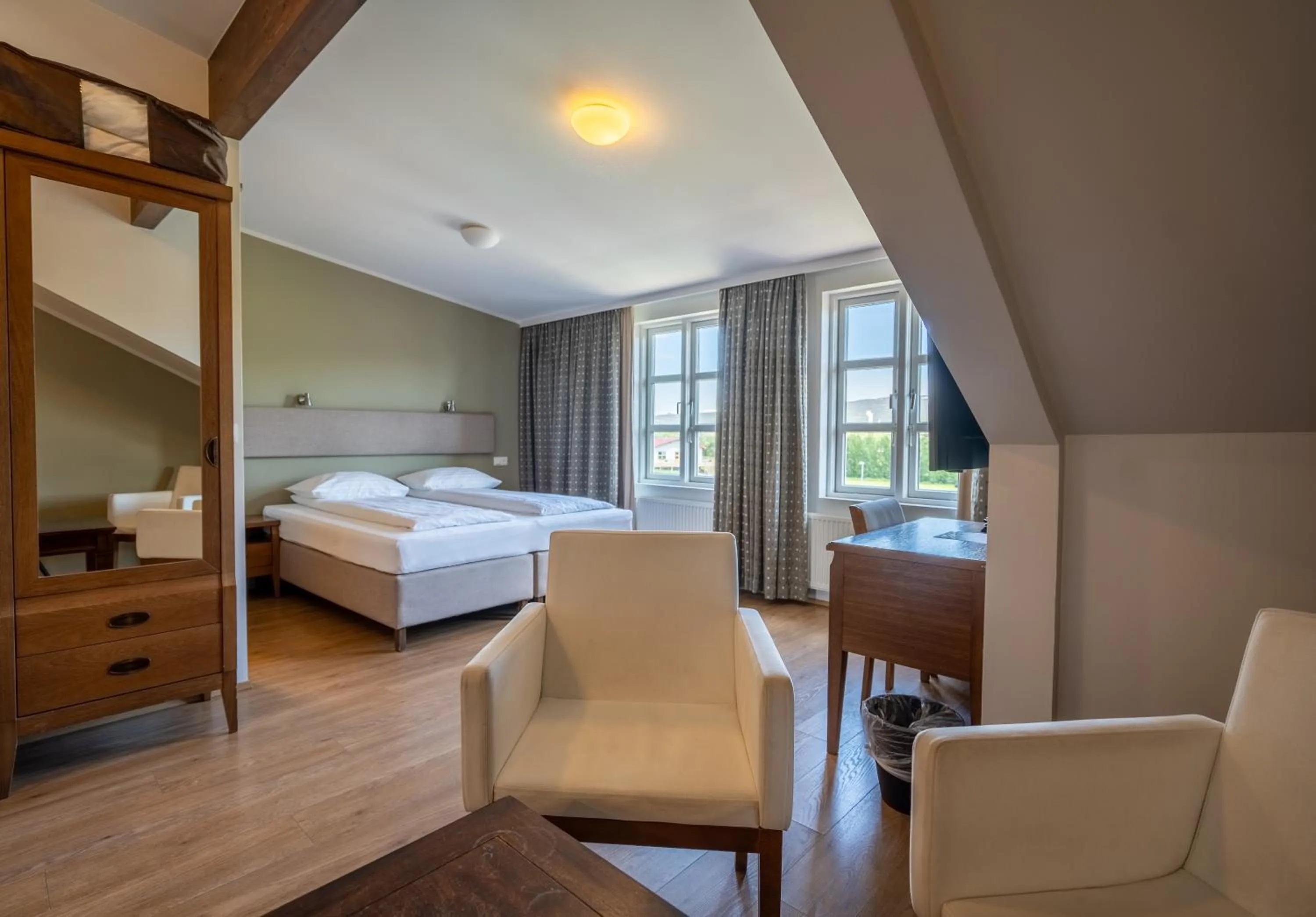 Seating area, Bed in Gistihúsið - Lake Hotel Egilsstadir