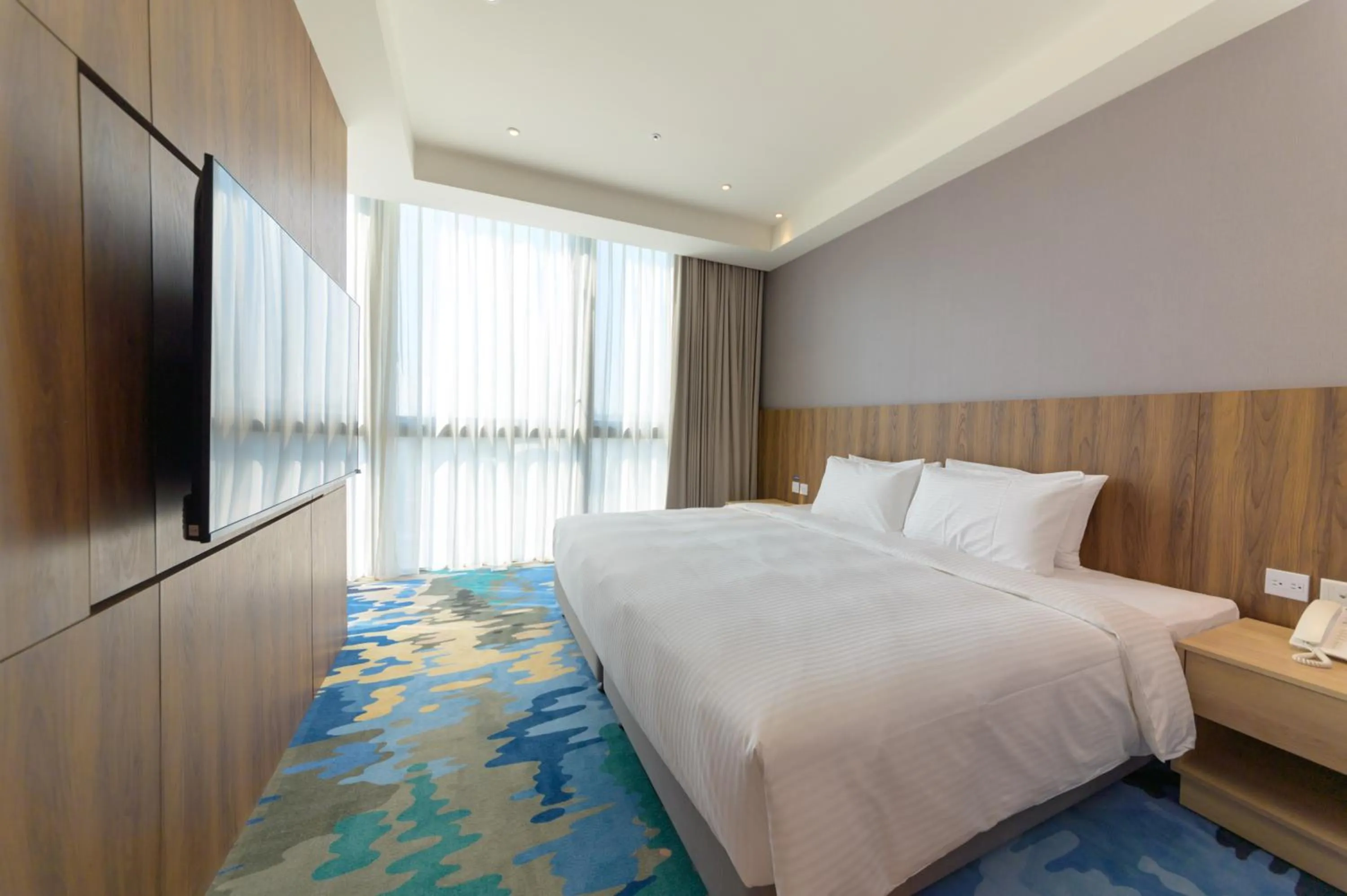 Bed in JANDA Golden Tulip Hotel