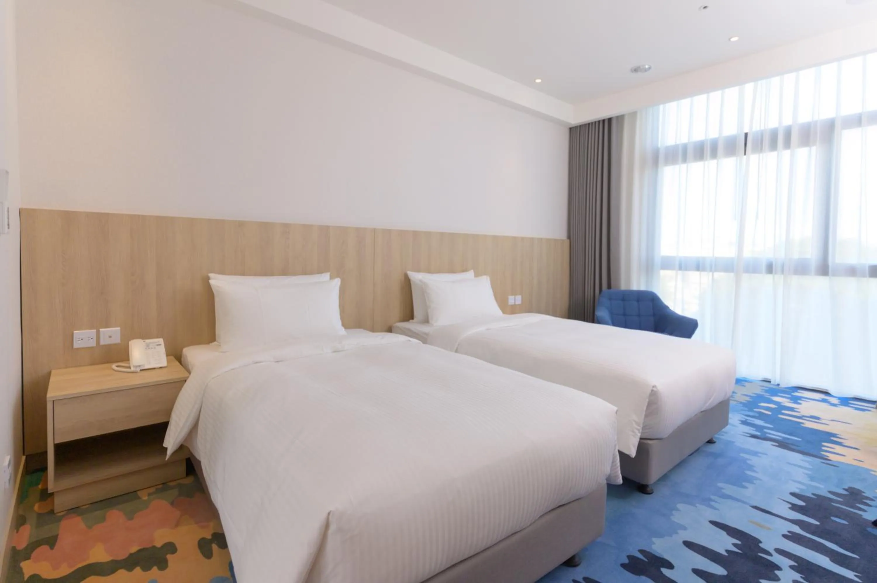 Bed in JANDA Golden Tulip Hotel