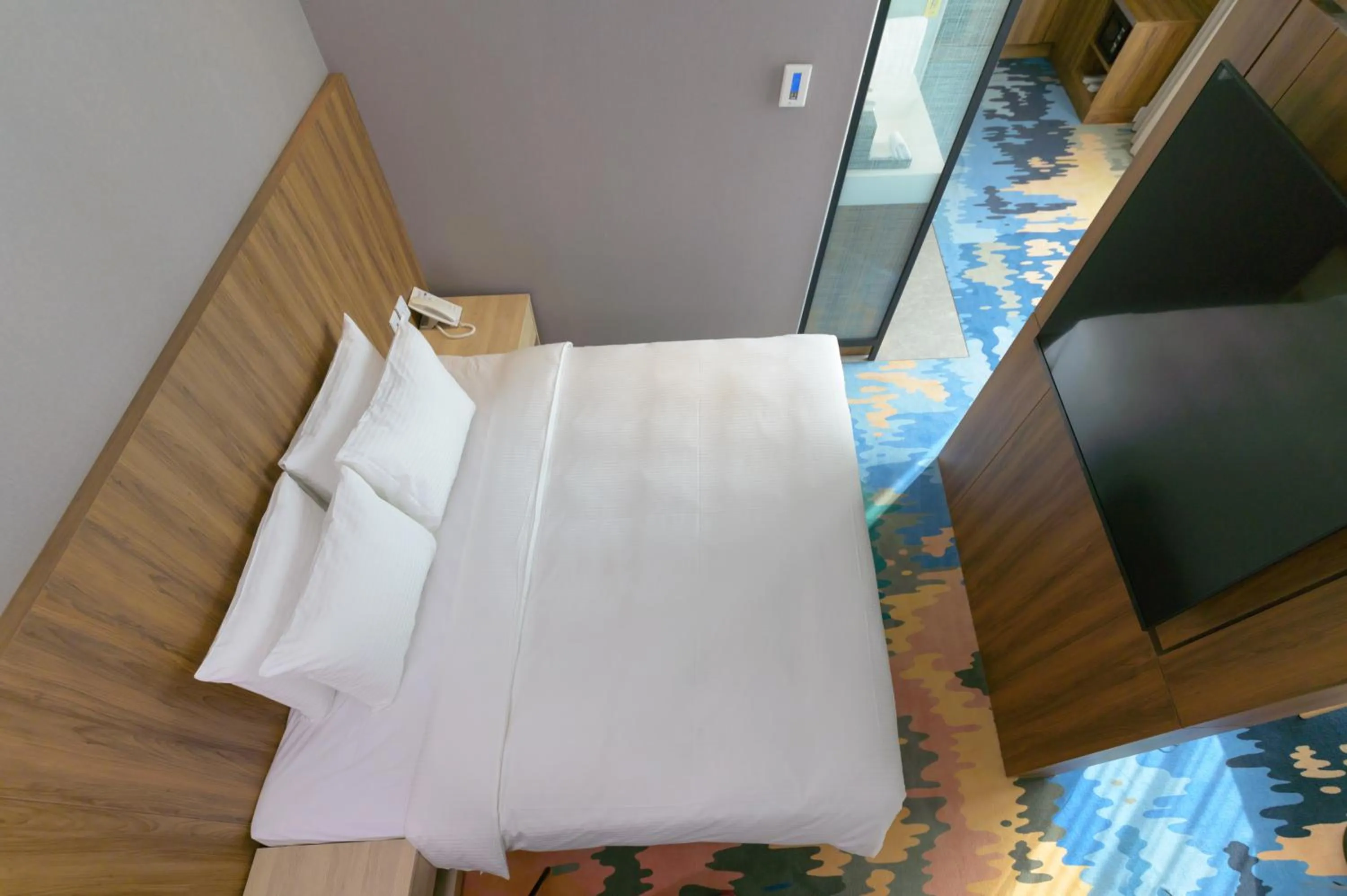 Bed in JANDA Golden Tulip Hotel